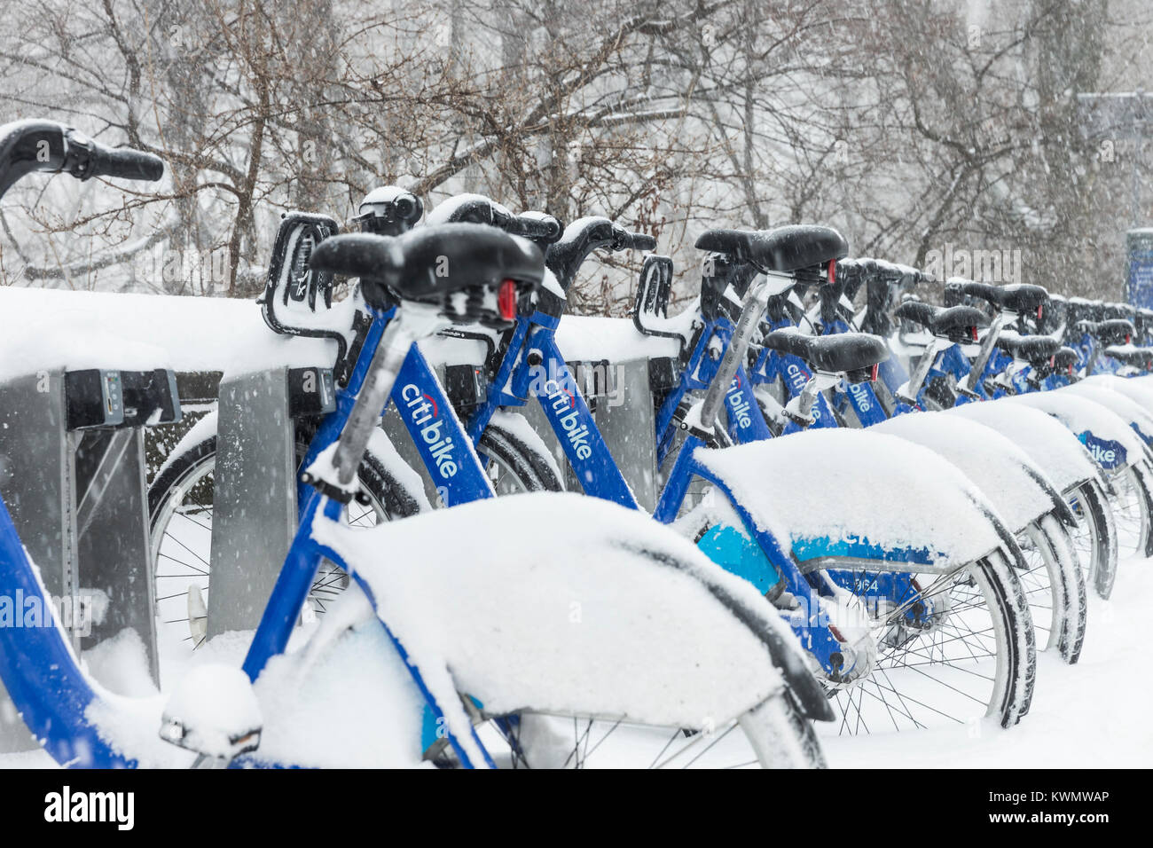 New York, United States. 04th Jan, 2018. Rental bicycles covered by heavy snow storm. A giant winter bomb cyclone hit the US East Coast on Thursday with freezing cold, wind and heavy snow Credit: lev radin/Alamy Live News Stock Photo