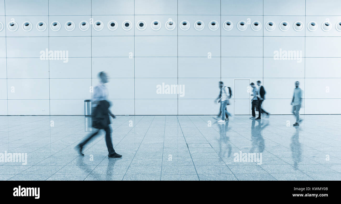 Blurred business people walking Stock Photo - Alamy