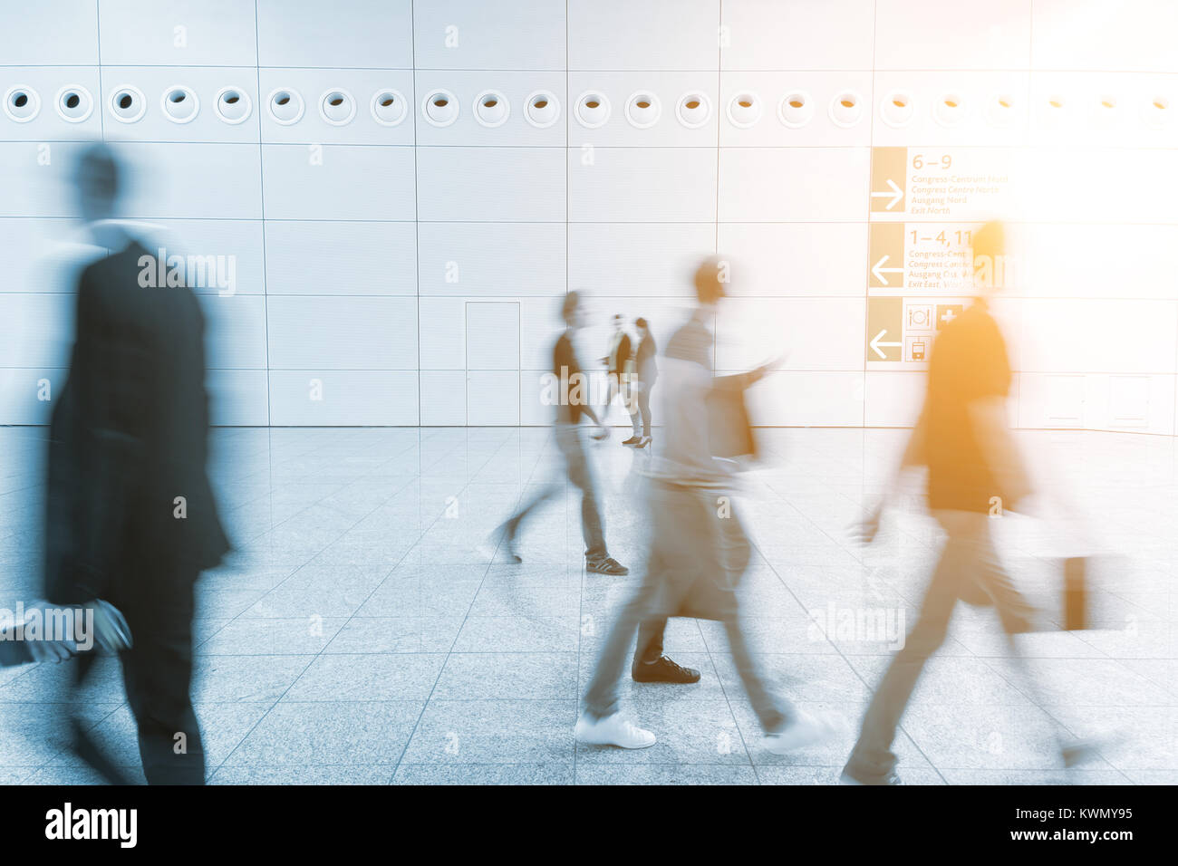 Blurred business people walking Stock Photo - Alamy