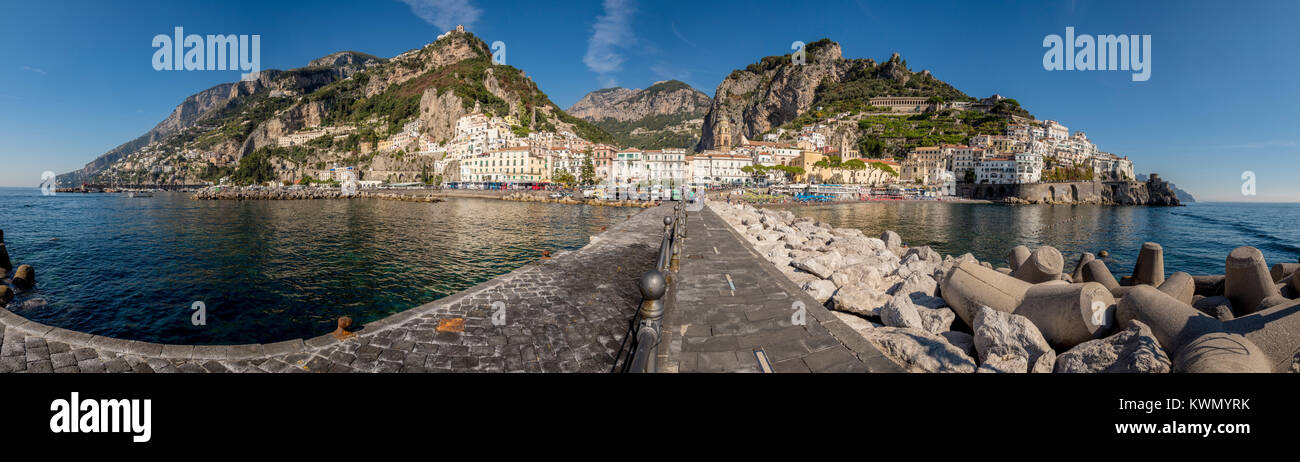 Panoramic view of the jetty and sea defences with the cliffside town of Amalfi in the background. Italy. Stock Photo
