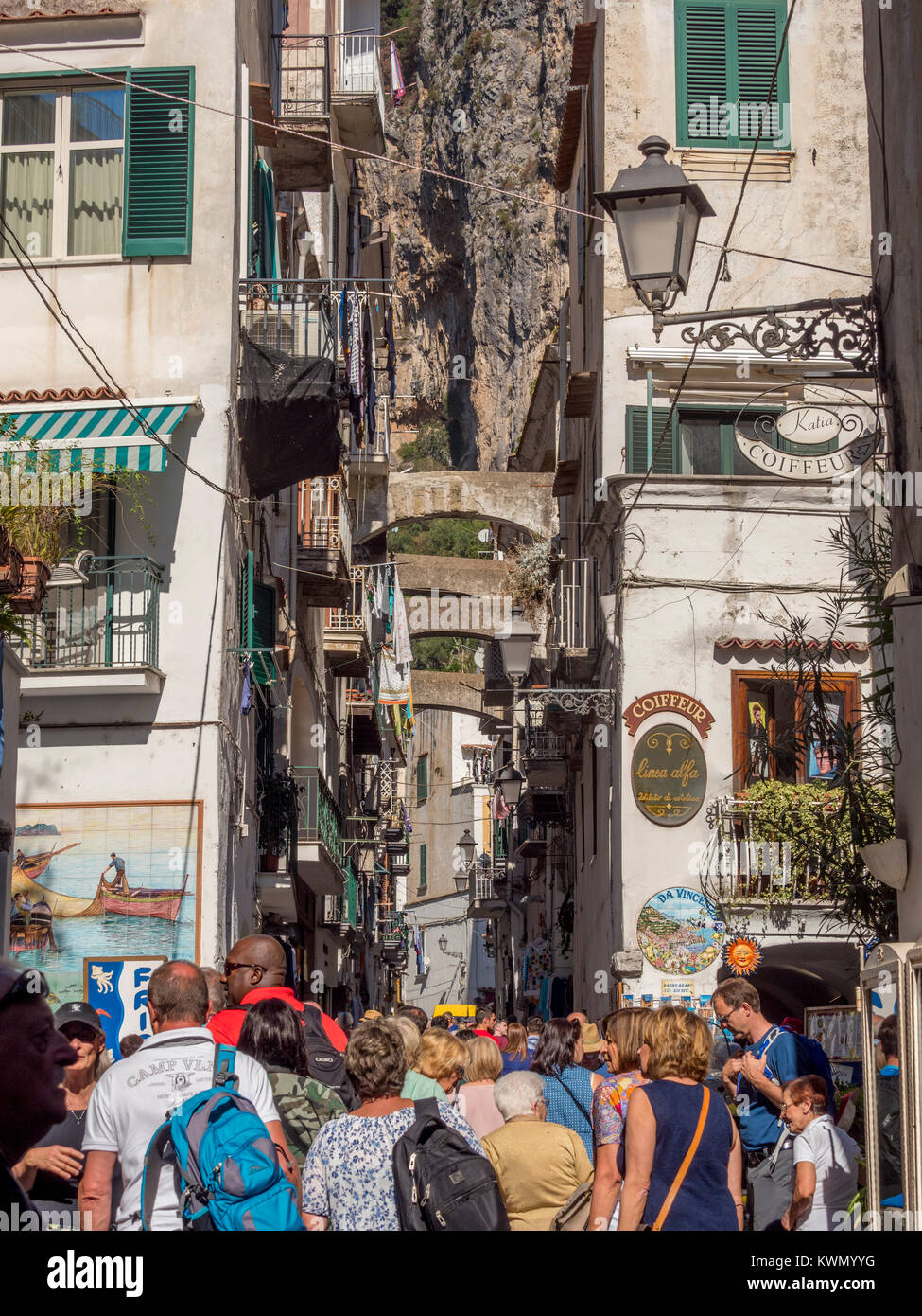 Narrow streets of Amalfi, Italy with tourists Stock Photo