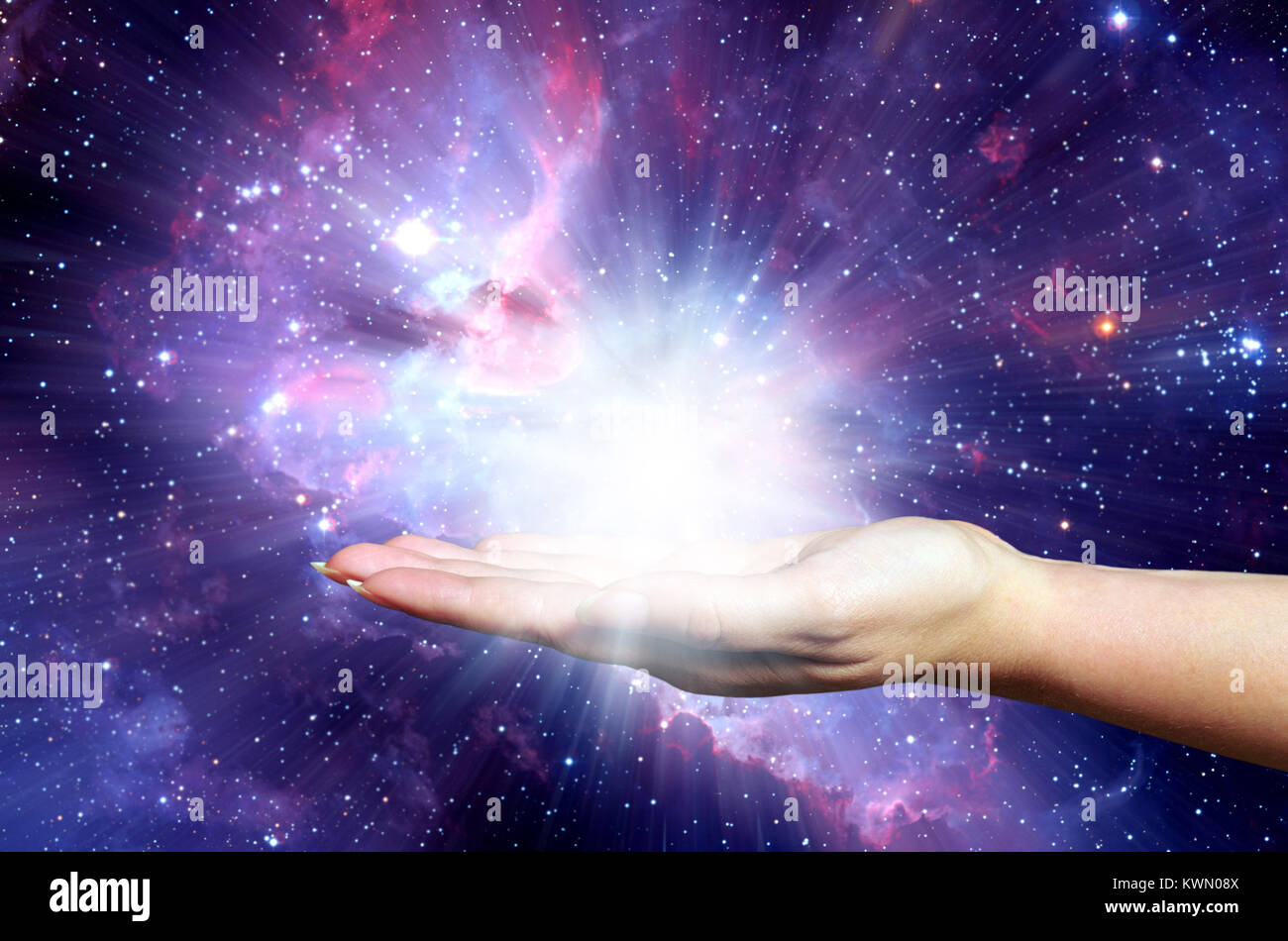open female hand holding a powerful light - Elements of this image furnished by NASA Stock Photo