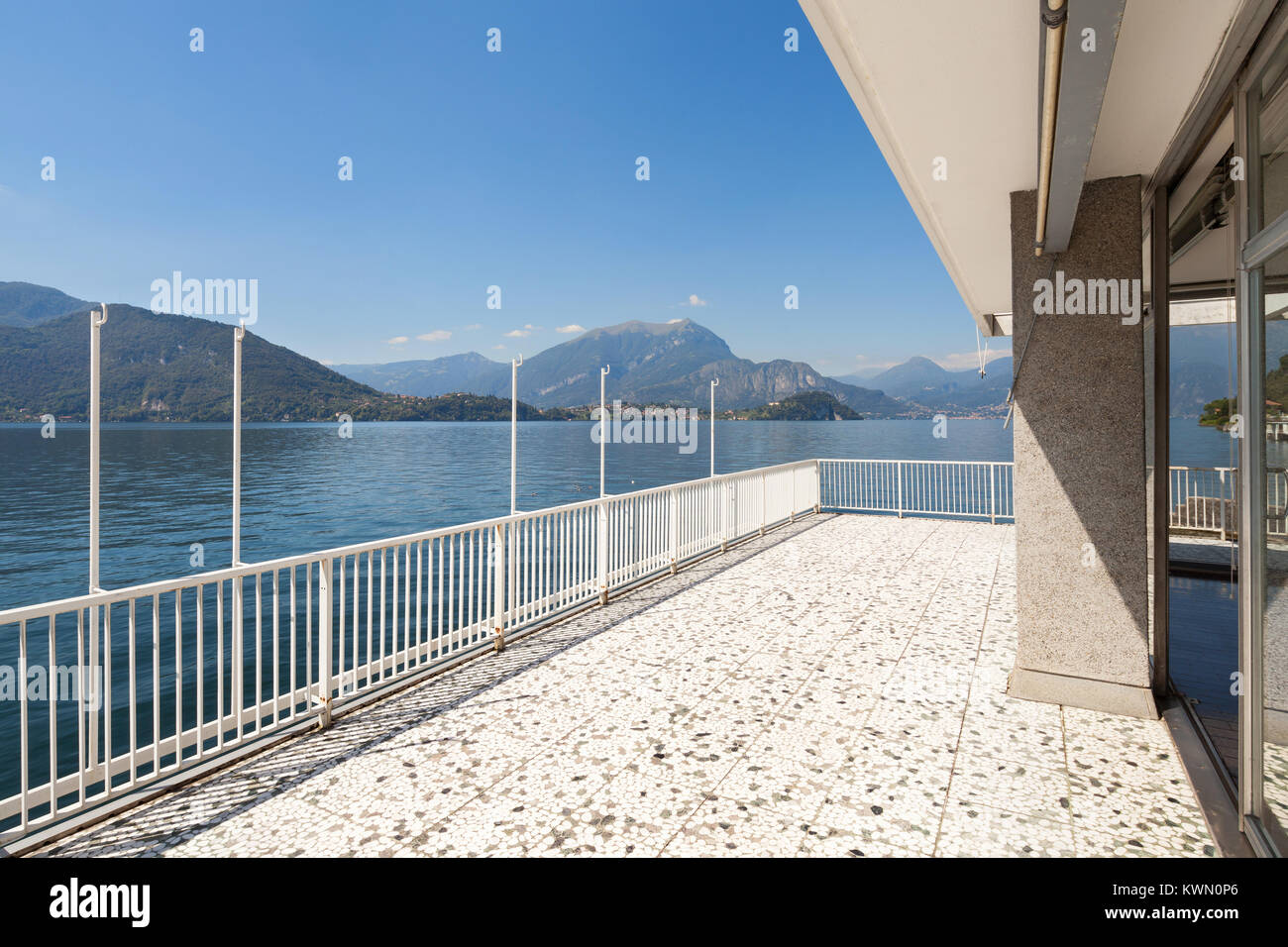 Image showcasing Panoramic view from the balcony of an old penthouse, lake and mountains ...