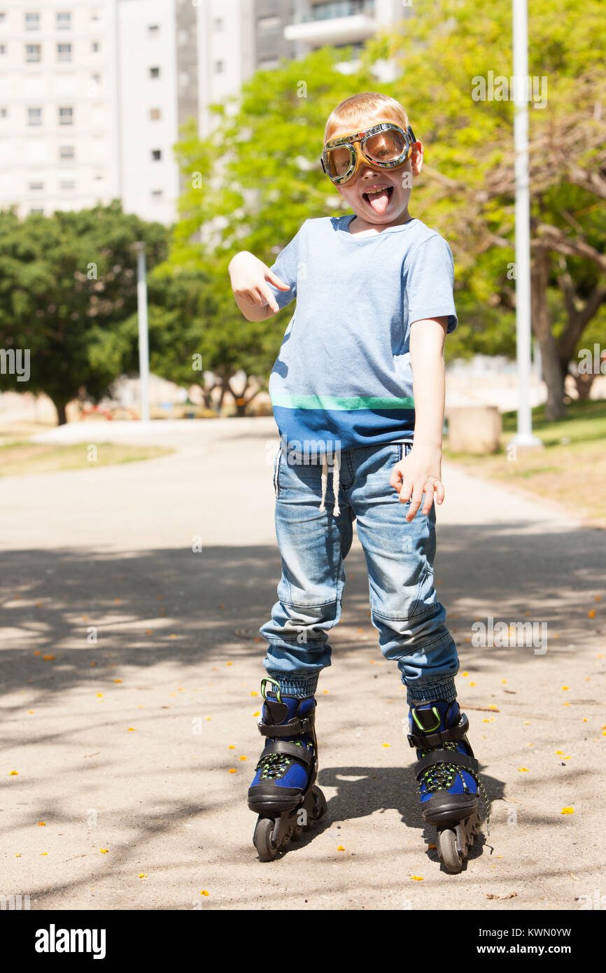 Playfully rollerblader with aviator glasses Stock Photo