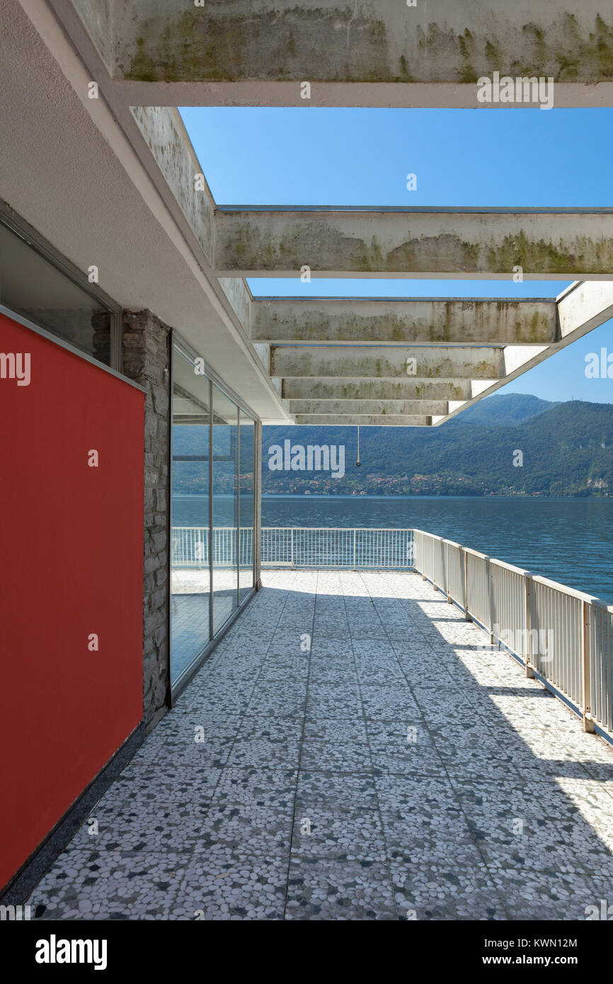 Panoramic view from the balcony of an old penthouse, lake and mountains ...