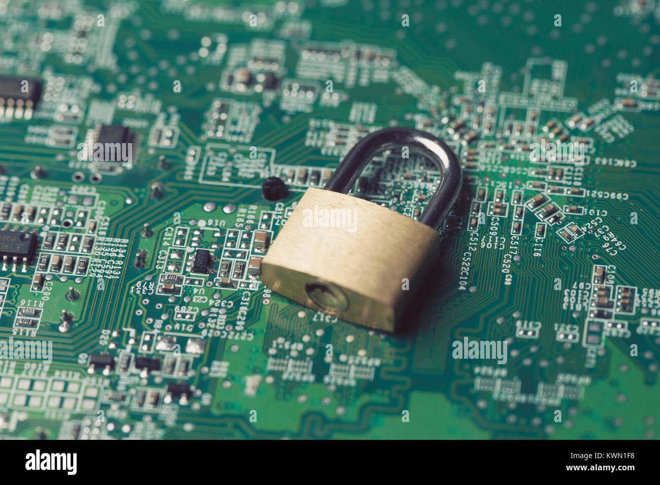 Padlock on a computer electronic circuit board. Technology security ...