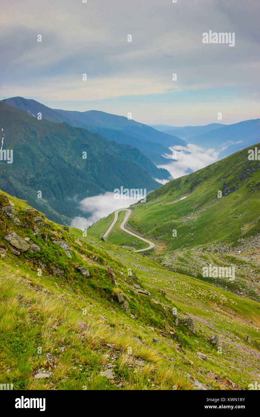 Spectacular view of Fagaras Mountains, Romania with low level clouds and fog Stock Photo