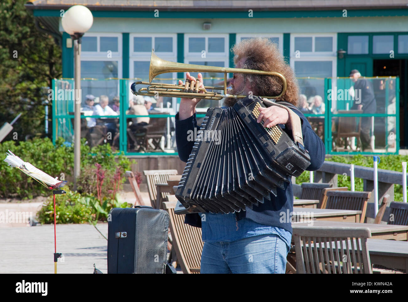 Street musician at the pier of Wustrow, Fishland, Mecklenburg-Western Pomerania, Baltic sea, Germany, Europe Stock Photo