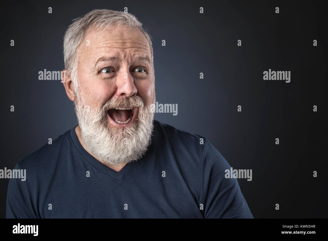 Old man in shirt and scared looking a way Stock Photo