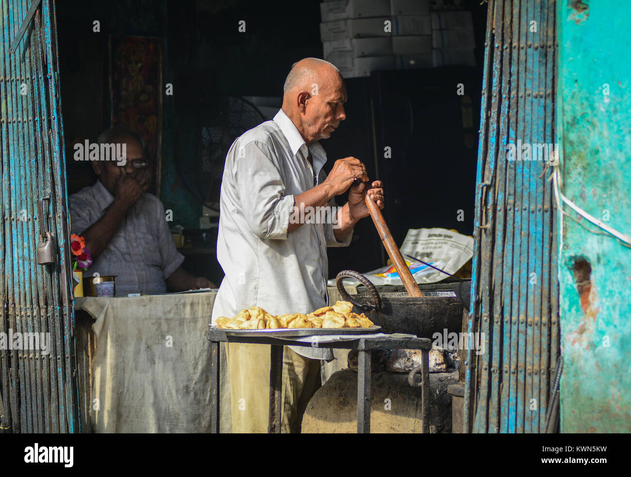 Bodhgaya, India - Jul 9, 2015. Unidentified market vendor selling food in a local restaurant in Delhi, India. Street foods in India are reasonably pri Stock Photo