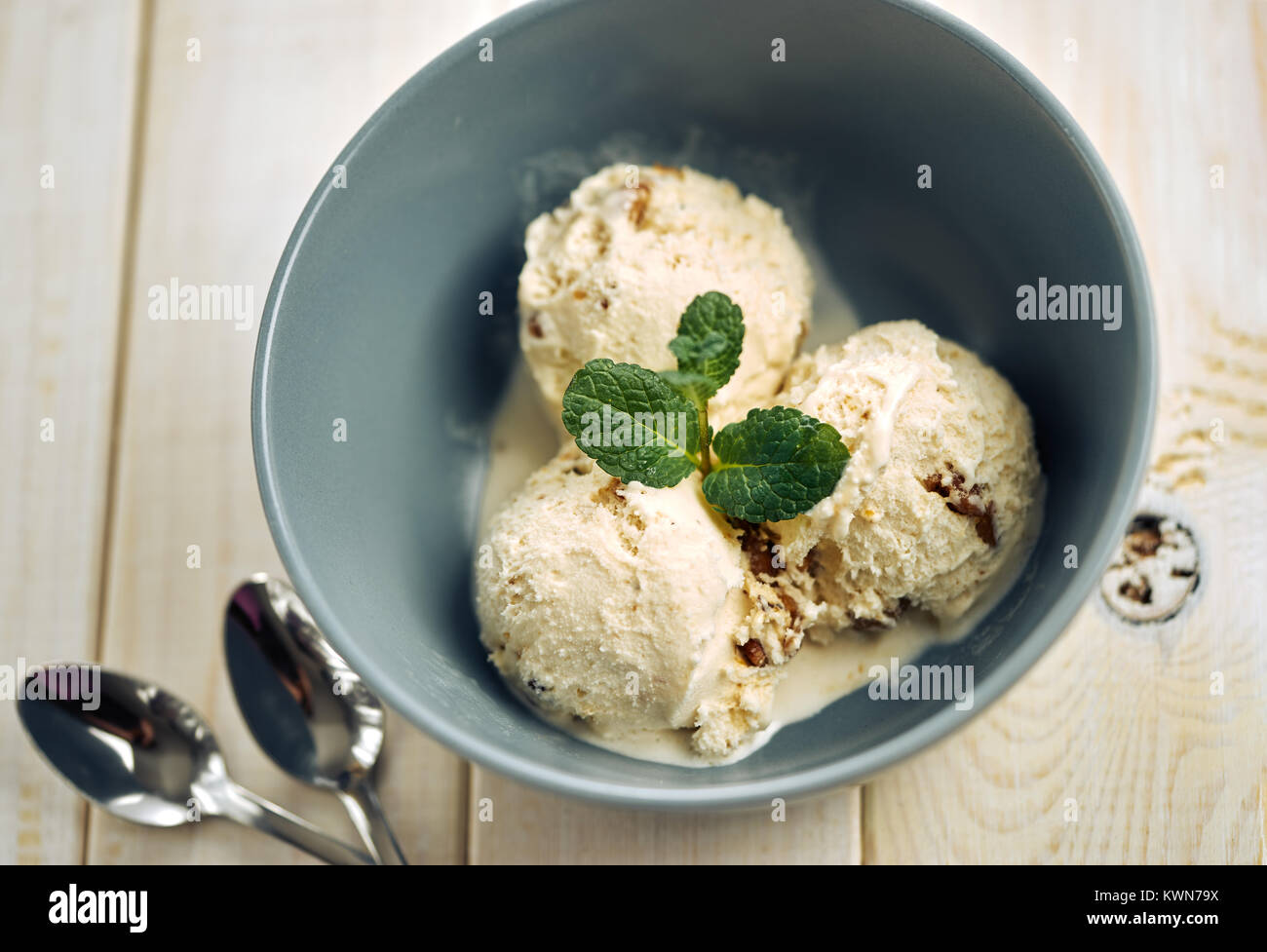 Vanilla ice cream in blue bowl Stock Photo - Alamy