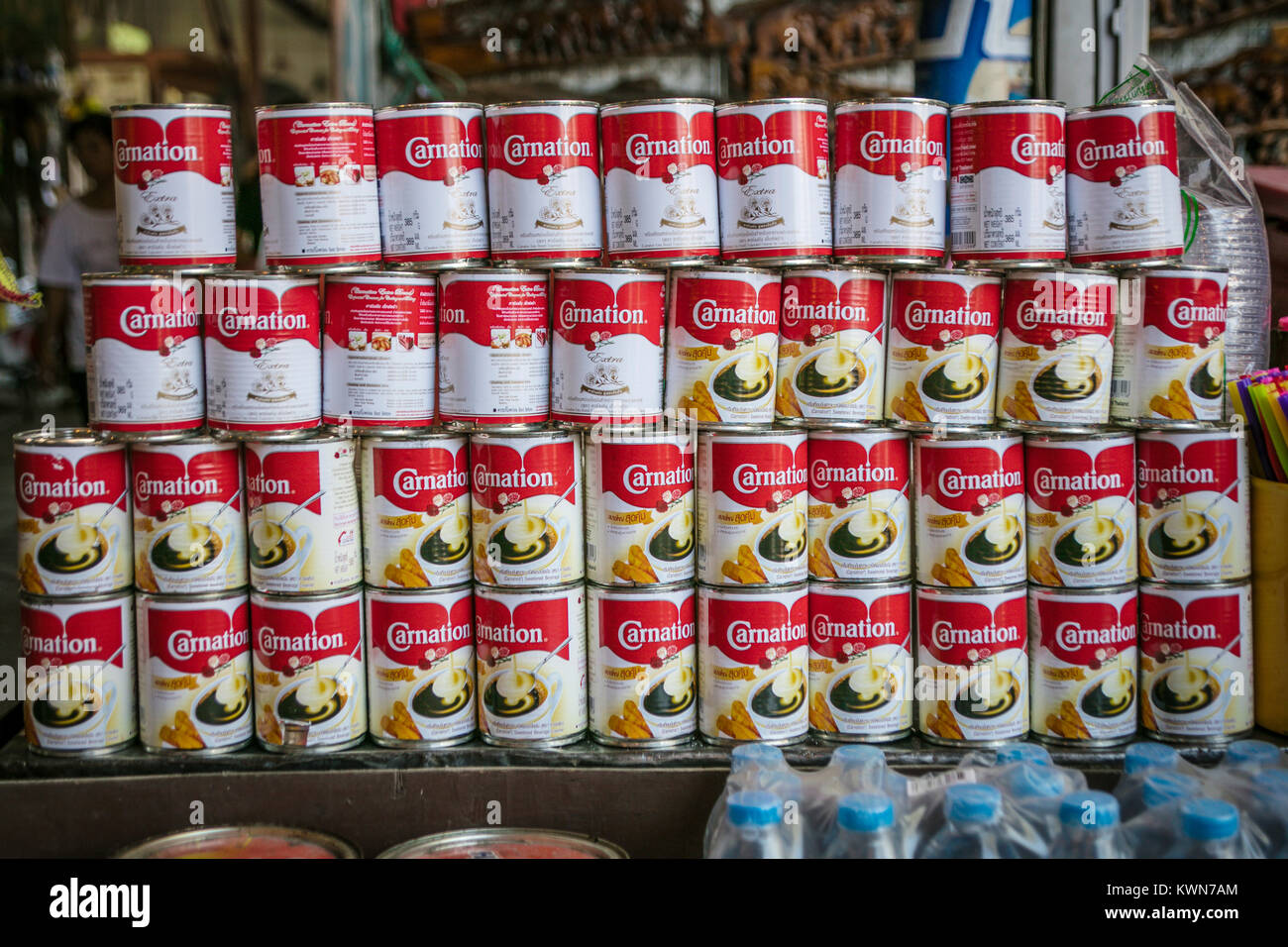 Display of Carnation evaporated milk, Damnoen Saduk Floating Market, Thailand. Stock Photo
