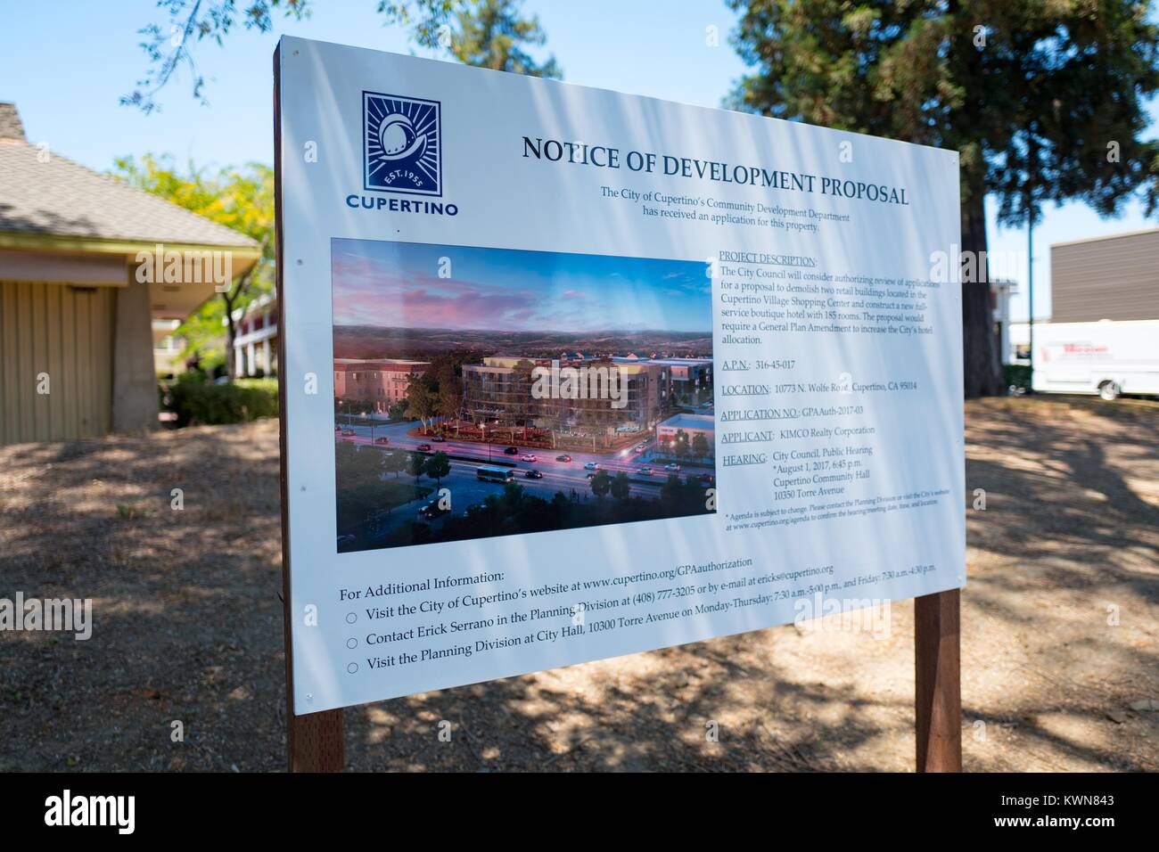 Signage announcing plans for the development of a new luxury hotel near the Apple Park, known colloquially as 'The Spaceship', the new headquarters of Apple Inc in the Silicon Valley town of Cupertino, California, July 25, 2017. Since Apple's announcement of its new headquarters, commercial real estate prices near the headquarter's site have increased dramatically, and several new developments have been planned. Stock Photo