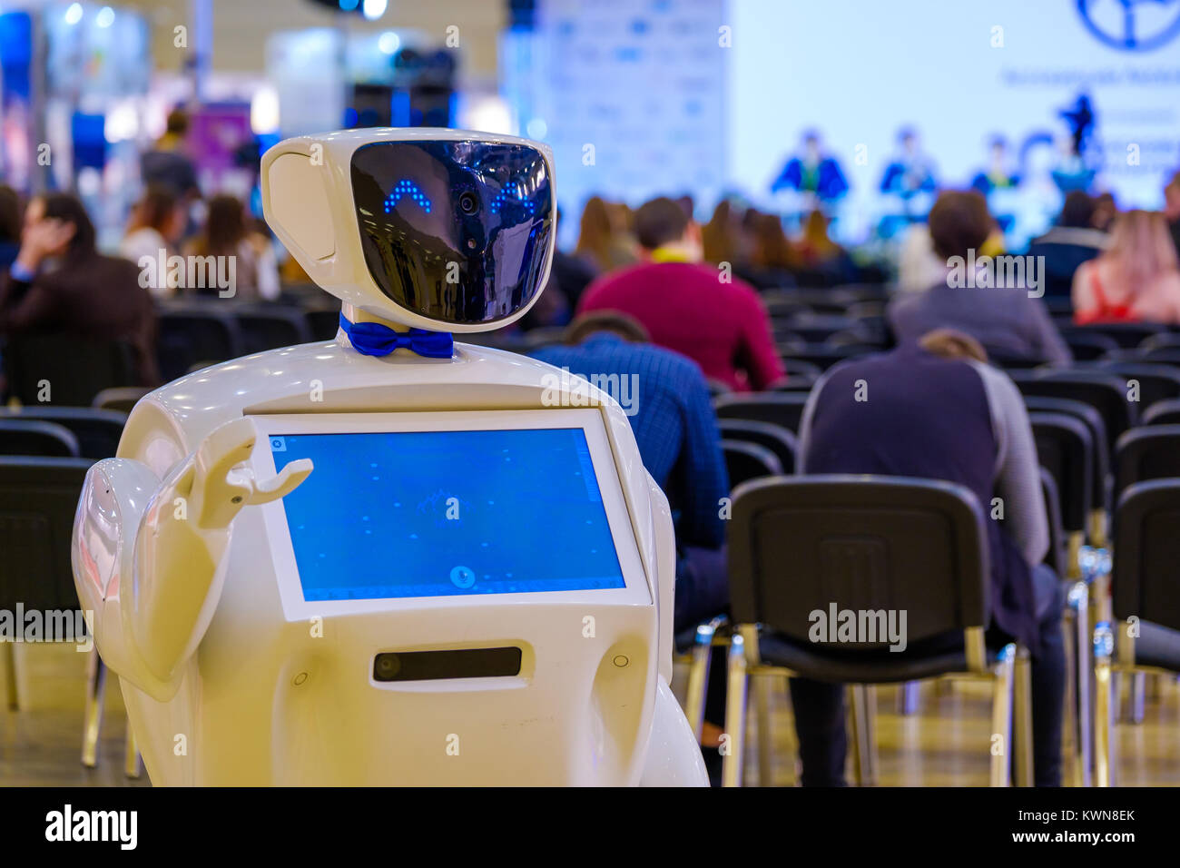 Robot welcomes conference guests Stock Photo