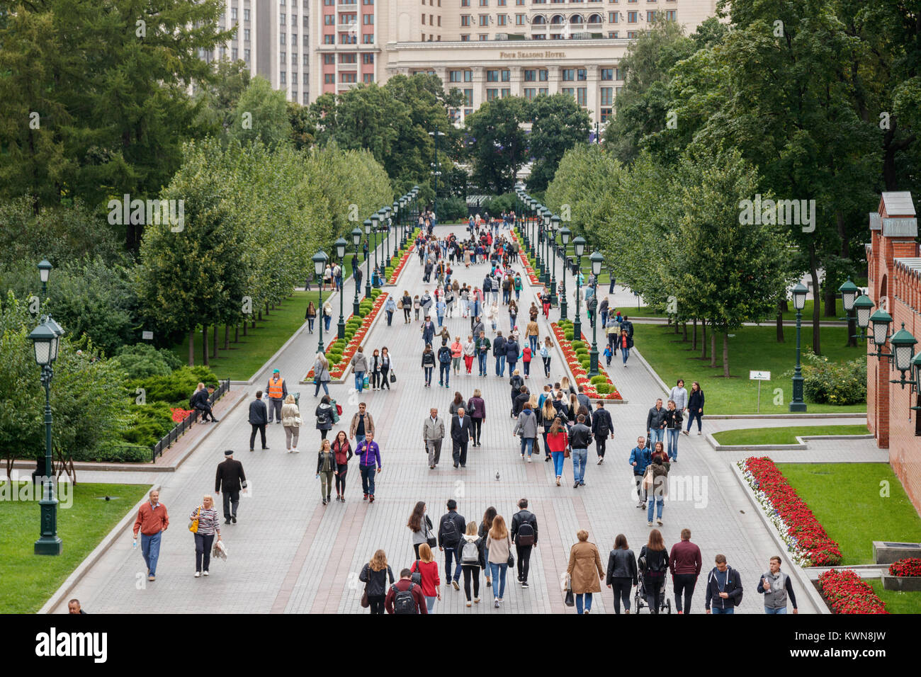Tourists walking through the Alexandrovsky Garden, a park along the western Kremlin wall. Moscow, Russia. Stock Photo