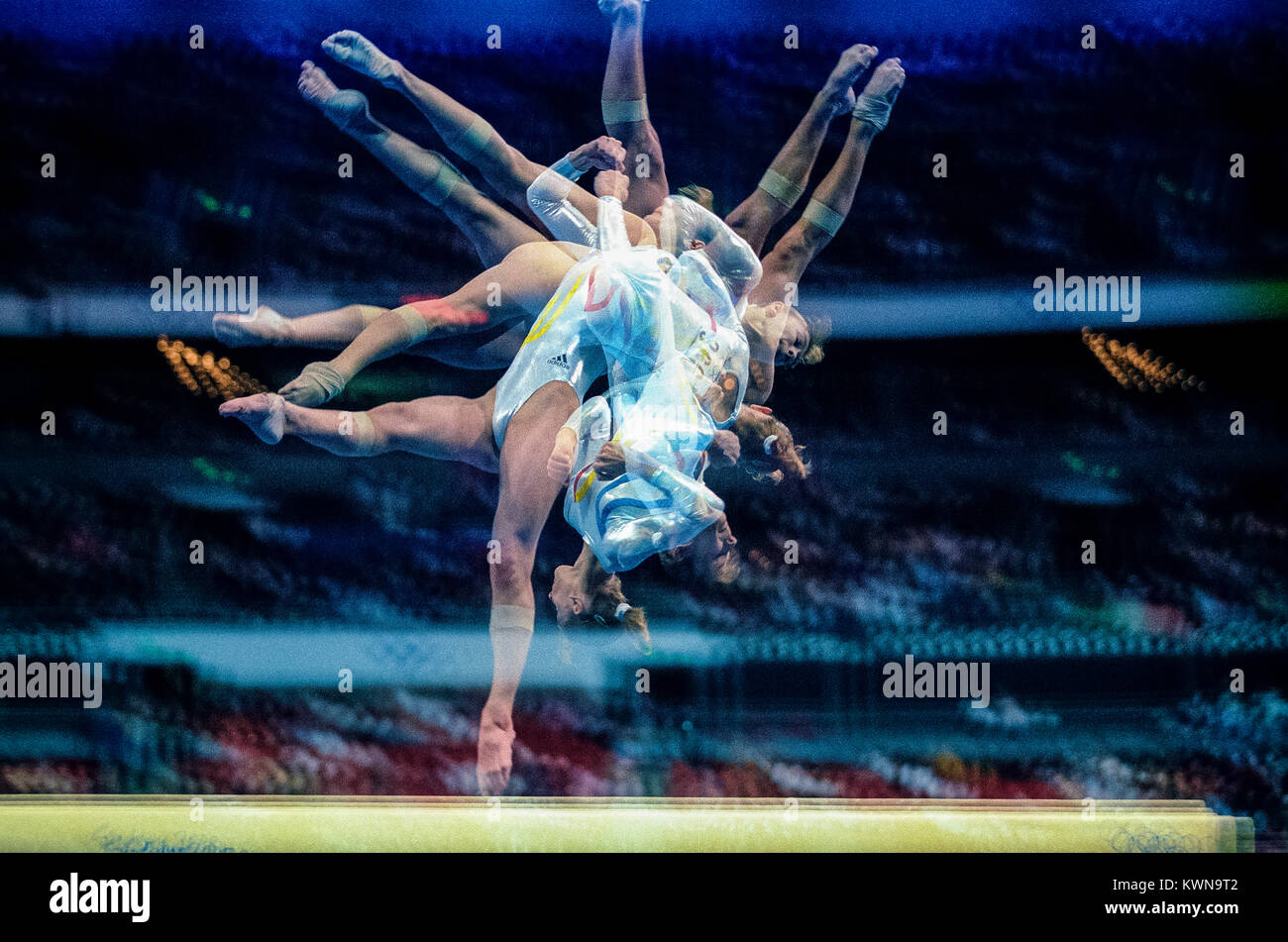 Multiple exposure of female gymnast preforming on the balance beam Stock Photo