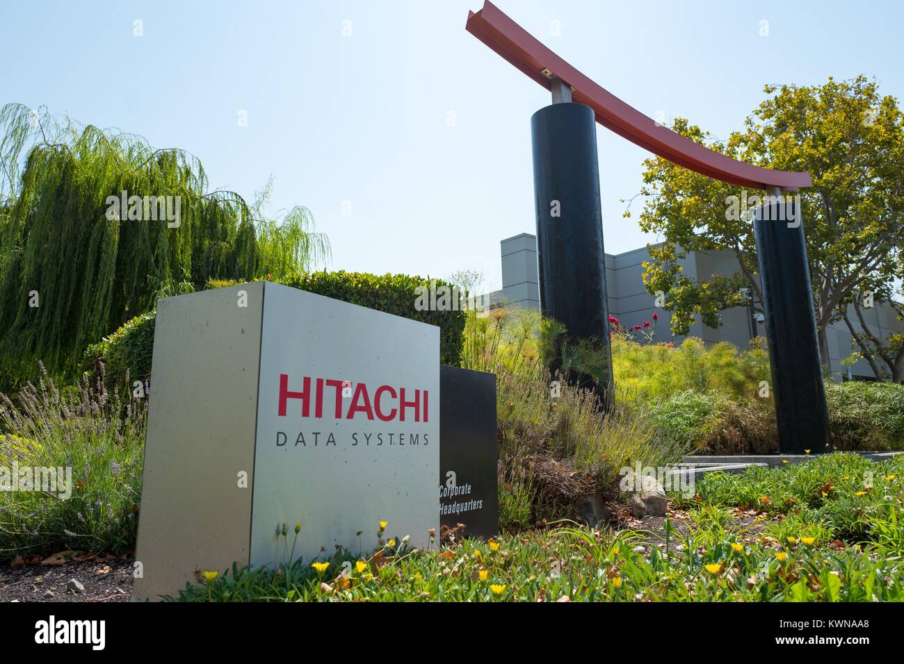 Signage with logo and Japanese arch at the Silicon Valley headquarters of Japanese multinational conglomerate Hitachi, Santa Clara, California, August 17, 2017. Stock Photo