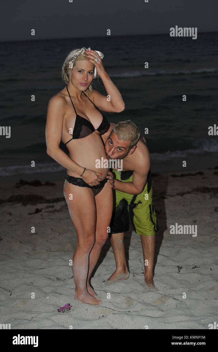 SAN CLEMENTE, CA - APRIL 18: (EXCLUSIVE COVERAGE) Shayne and Nik Lamas-Richie celebrate their one-year anniversary on the beach. these are the first known shots of Shayne pregnant.  Shayne looked glowing and amazing as she posed for husband Nik with her new baby bump.    Shayne and Nik are currently filming a reality Show.  Shayne Dahl Lamas (born November 6, 1985) is an American actress. She is known for her role as the Young Carly Corinthos on General Hospital (2005) and as the winner of the twelfth season of The Bachelor.  Lamas is the daughter of Renegade Actor Lorenzo Lamas and Michele Ca Stock Photo