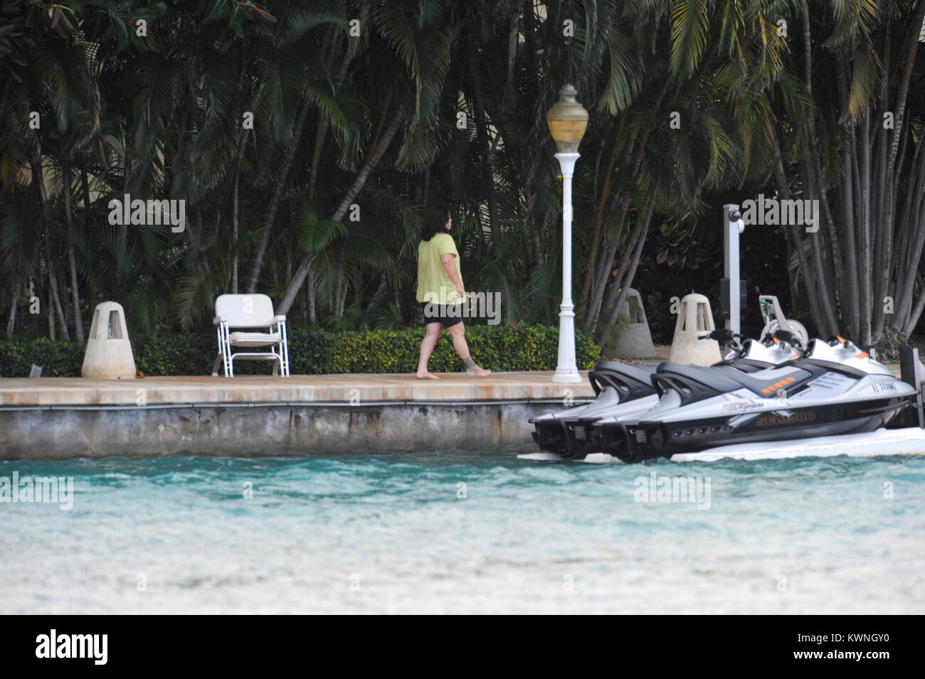 MIAMI BEACH, FL - JUNE 11:  (EXCLUSIVE COVERAGE) Rosie O'Donnell (wearing no make up and a bandage on her foot.)  Enjoys her day as she sits on her dock texting from her estate in Miami. Roseann 'Rosie' O'Donnell (born March 21, 1962) is an American stand-up comedienne, actress, singer, author and media personality. She has also been a magazine editor and continues to be a celebrity blogger, LGBT rights activist; television producer and collaborative partner in the LGBT family vacation company R Family Vacations.   On June 11, 2011 in Miami Beach, Florida    People:  Rosie O'Donnell Stock Photo