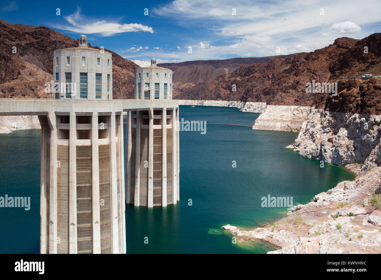 Hoover Dam Towers on the blue Lake Mead. Hoover Dam is a concrete arch-gravity dam in the Black Canyon of the Colorado River, on the border between th Stock Photo