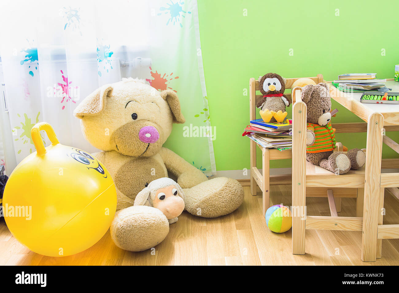 Kids Room Interior with Wooden Furniture Set. Teddy Bear on Chair Big Plush  Toys Books Crayons on Table. Window with Transparent Curtains Soft Dayligh  Stock Photo - Alamy