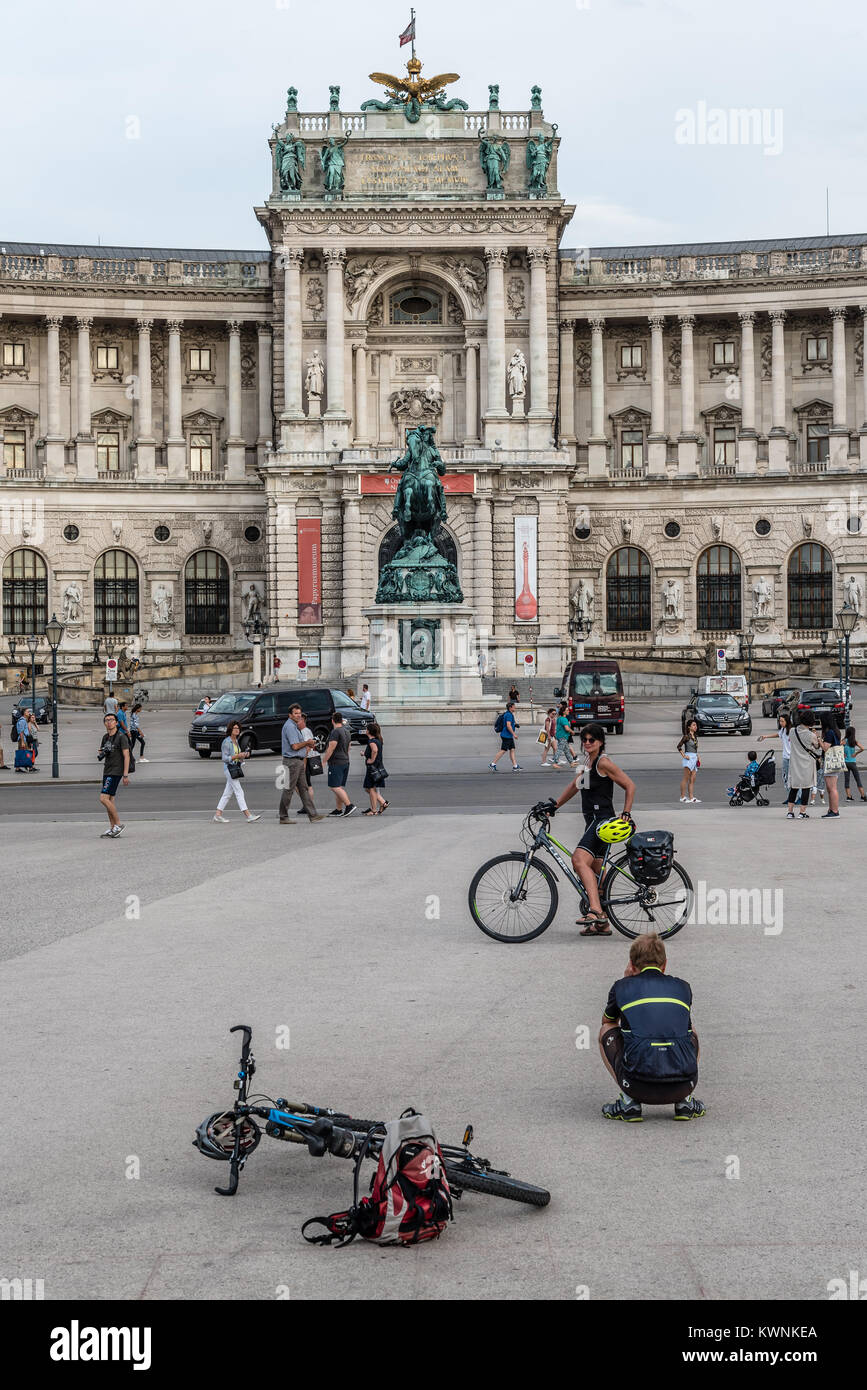 Vienna,  Austria - August 16, 2017: Cyclists taking photos in Heldenplatz in Vienna Stock Photo