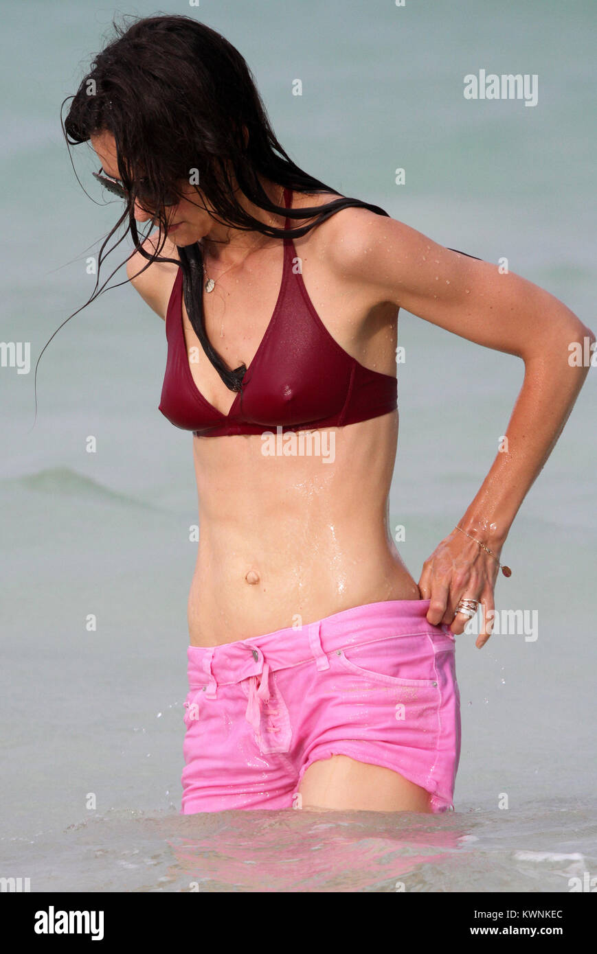 MIAMI BEACH, FL - JUNE 18: Katie Holmes and Suri Cruise had a fun day out  on beach today in Miami, outside their hotel. The famous mother and  daughter pair played in