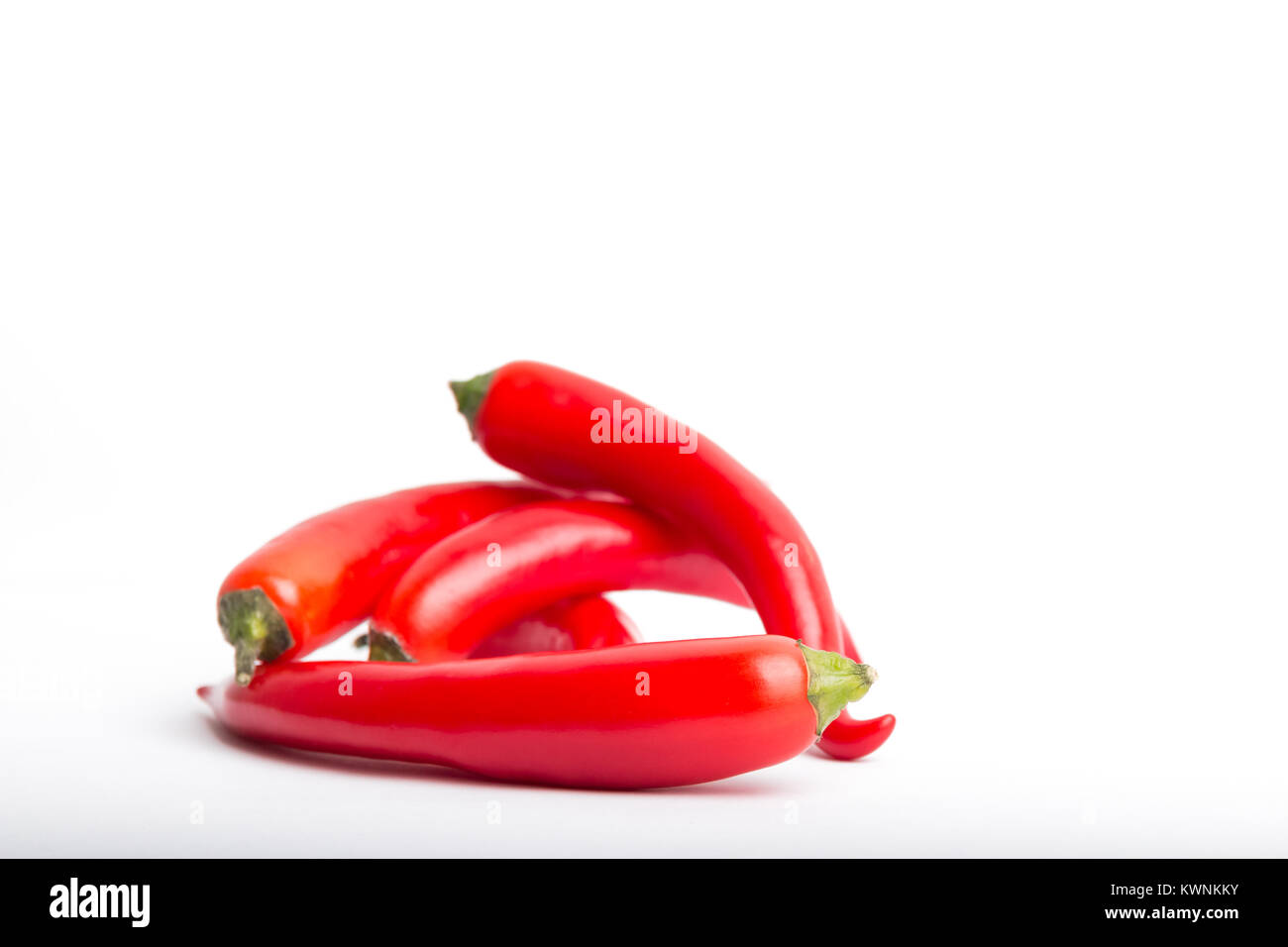 isolated red chili peppers on a white background Stock Photo - Alamy