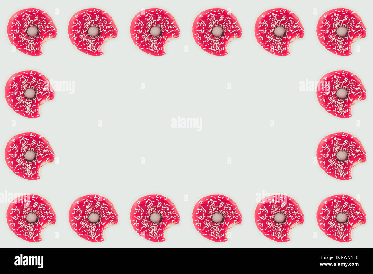 top view of frame of bitten glazed doughnuts isolated on white Stock ...