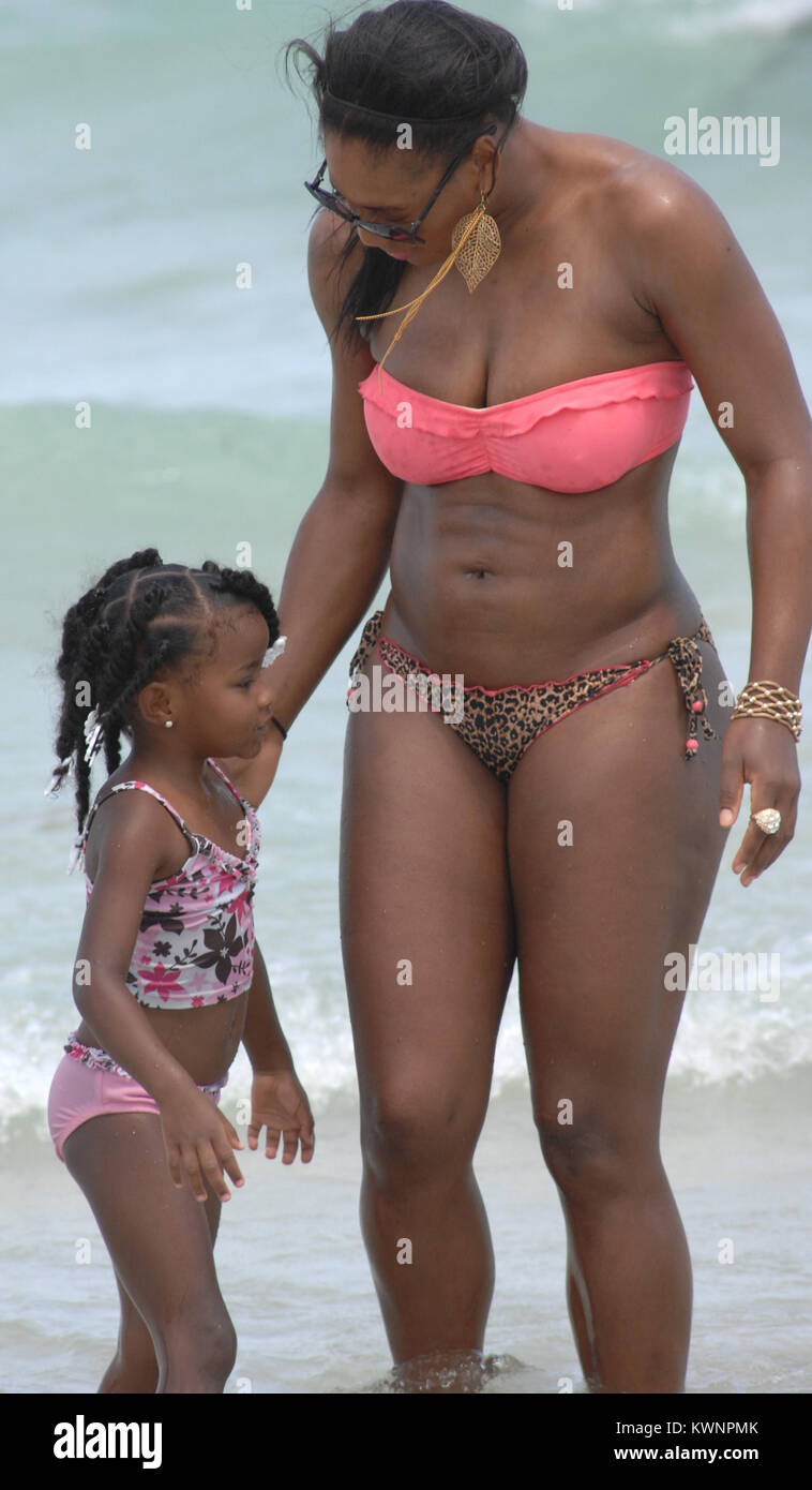 MIAMI BEACH, FL - APRIL 16:  Tennsi great Serena Williams took a break from her rehab efforts with a day at the beach.  The 29-year-old hit Sobe with friends and ate some lunch on the beach before  taking a dip in the ocean wearing a two piece swimsuit with a pink top and leopard print bottom.  on April 16, 2011 in Miami Beach, Florida.   People:  Serena Williams Stock Photo