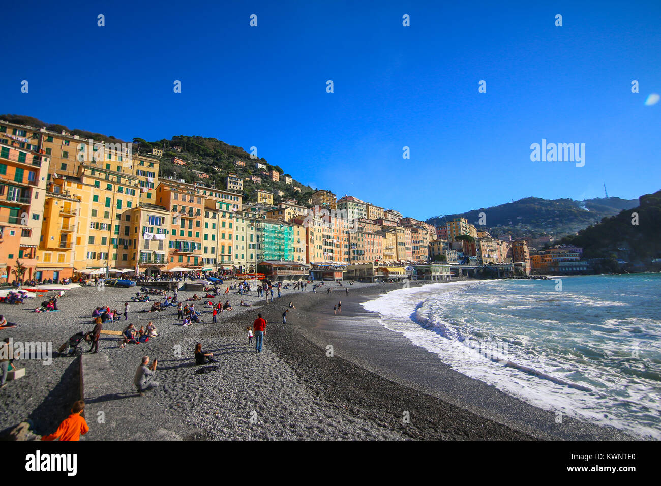 Camogli, Italy - People relaxing on the beach at the Mediterranean Sea Stock Photo