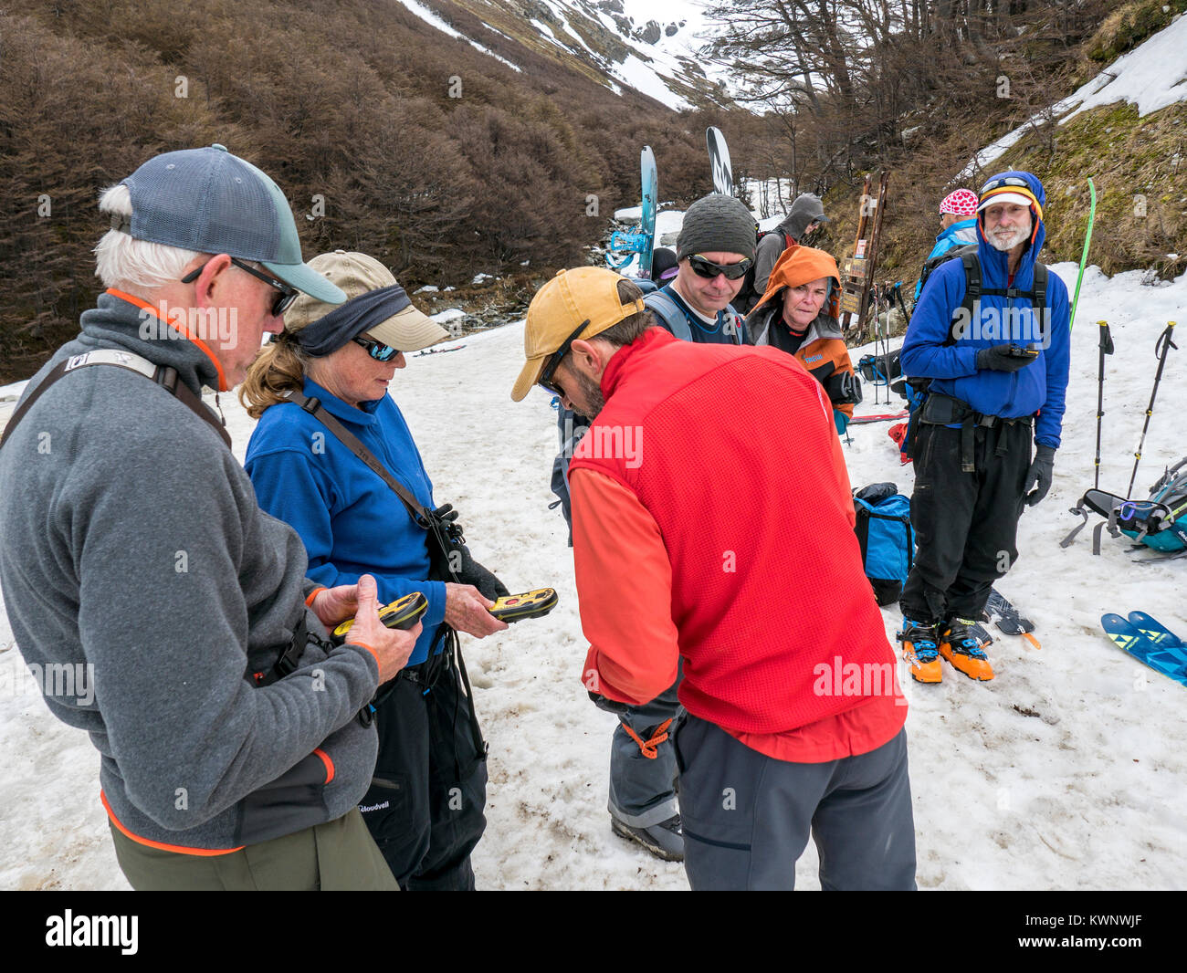 Backcountry alpine skiers test avalanche beacons & prep for roped glacier crossing; Glaciar Martial; Mount Krund; Cerro Castor; near Ushuaia Argentina Stock Photo