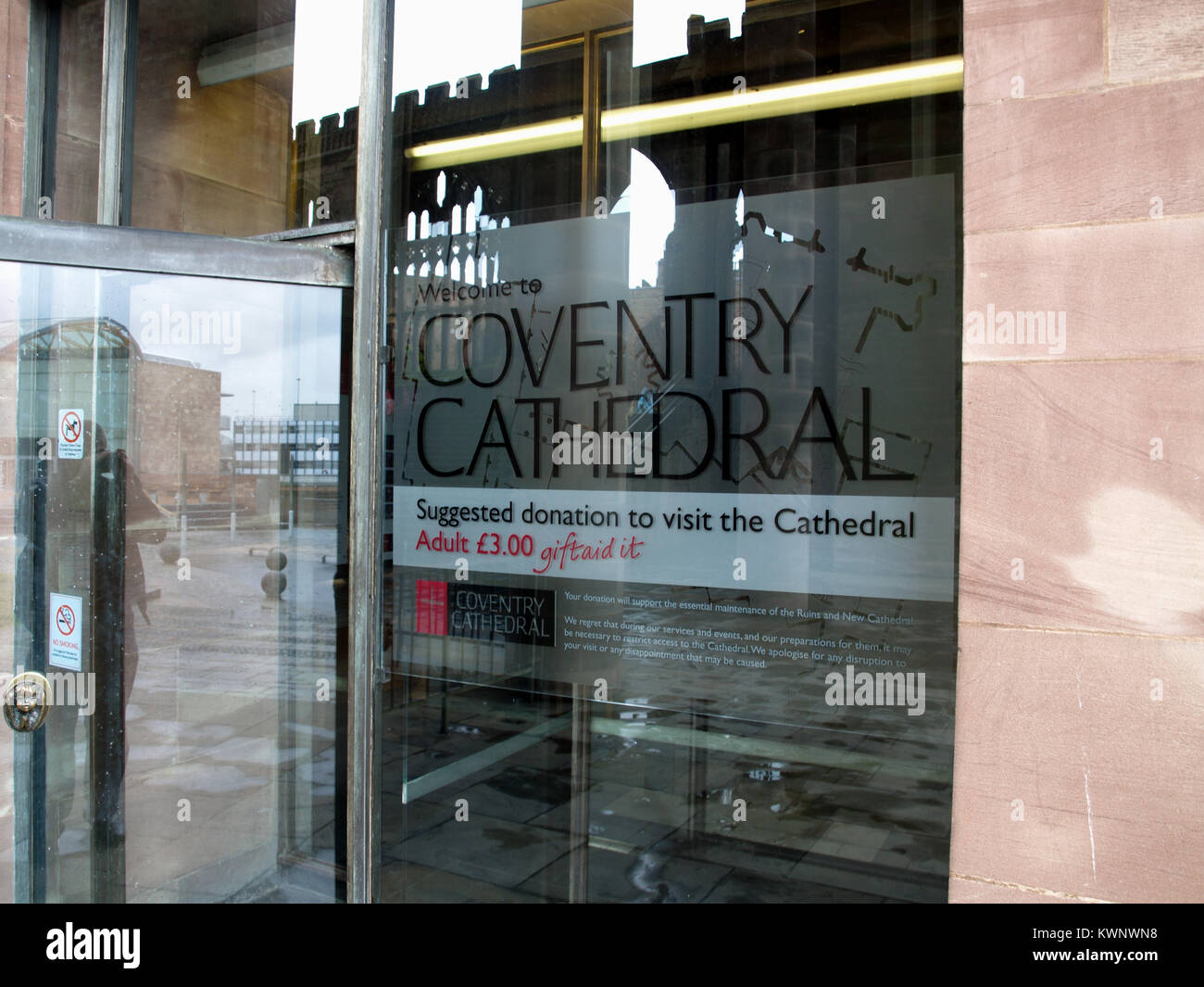 Frosted etched window graphics showing admission prices and times at