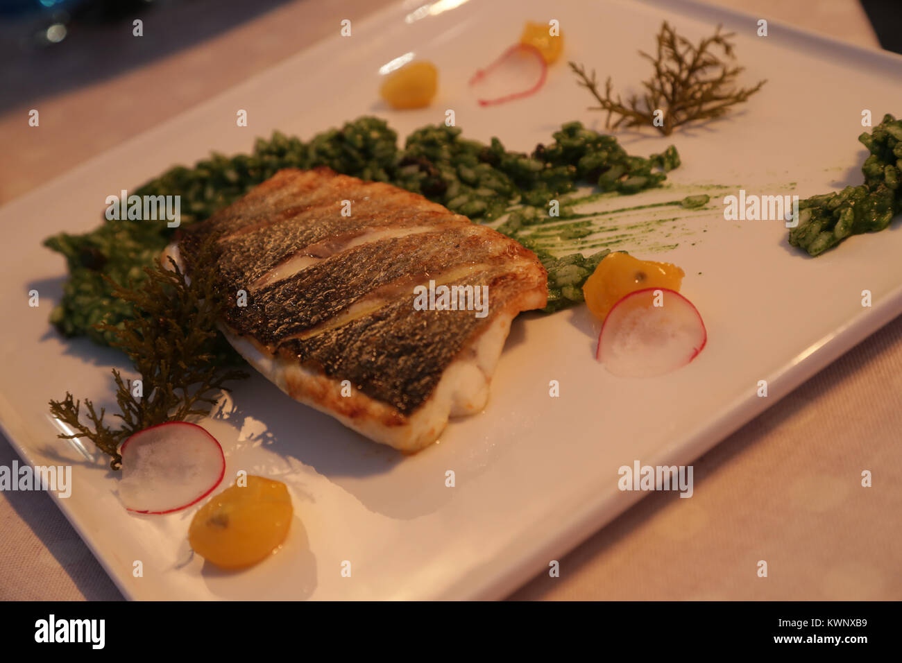 Fish fillet with green risotto, restaurant Croatia Stock Photo Alamy