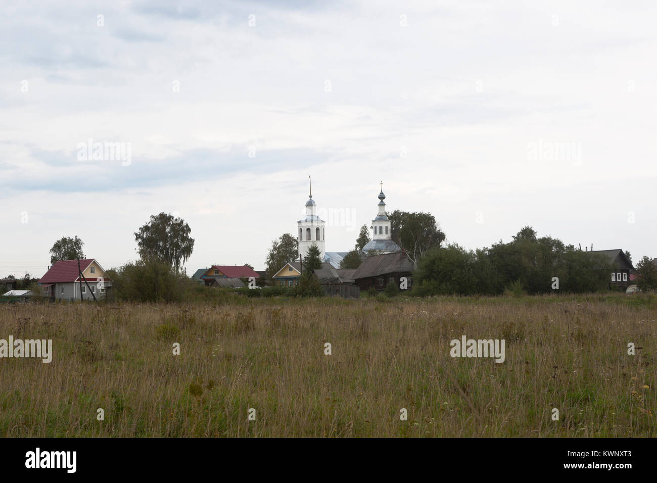 Landscape with Vondokurye village and the Church of the Life-Giving Trinity in Kotlas district, Arkhangelsk region, Russia Stock Photo