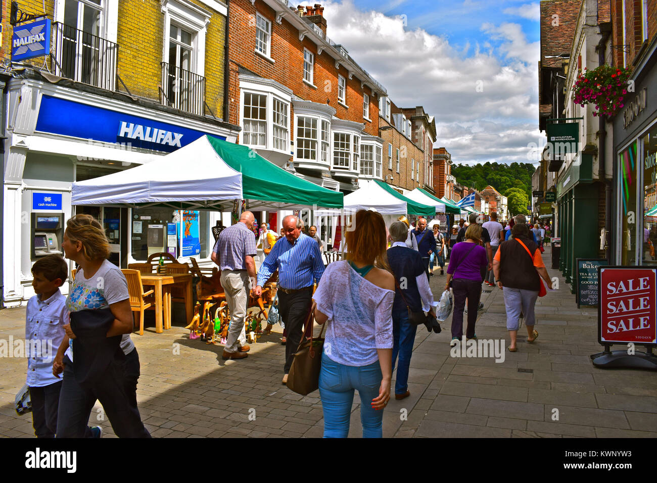 Shoppers strolling through the street market in the High Street