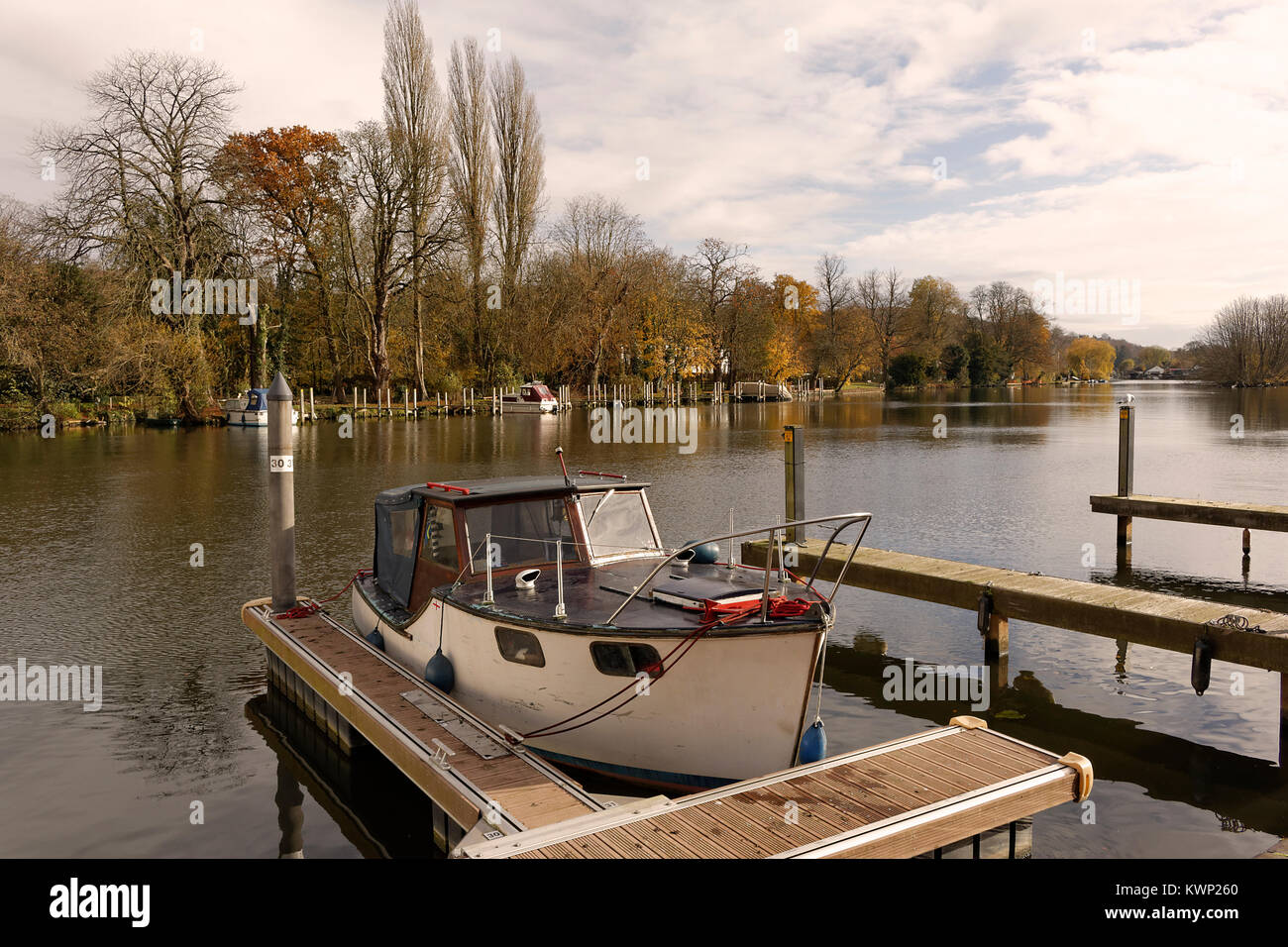 An image of a boat moored on the banks of the River at Henley on Thames, Oxfordshire, England, UK Stock Photo