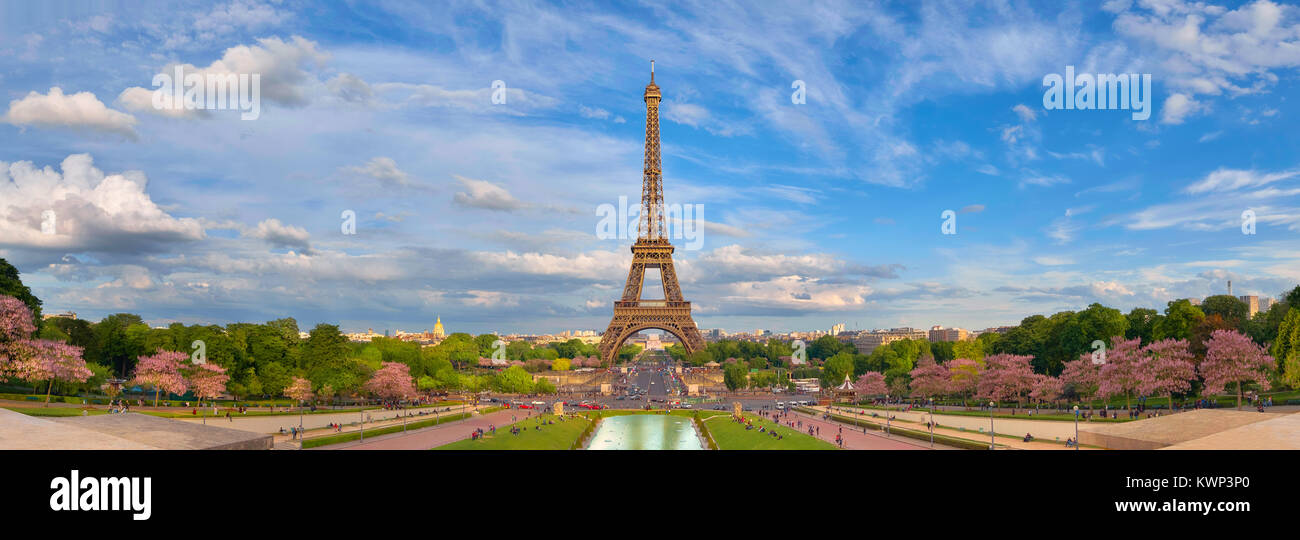 Paris, France. Panoramic image of Eiffel tower with fantastic clouds taken from fountains of Trocadero in Spring. Stock Photo