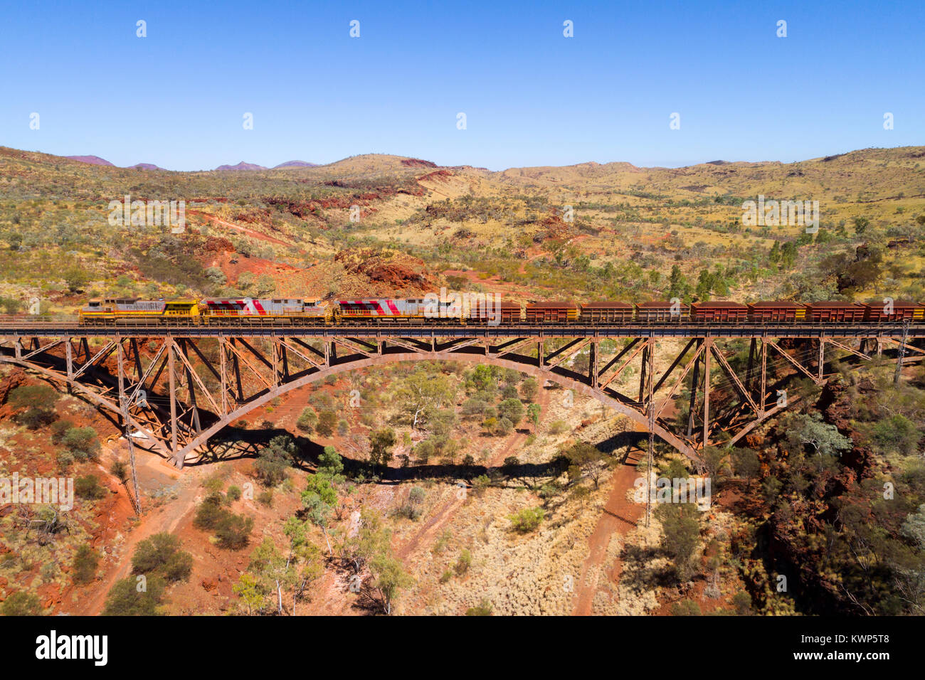 Iron Ore train crossing over the largest privately owned single span railway bridge in the southern hemisphere, Pilbara, Western Australia Stock Photo