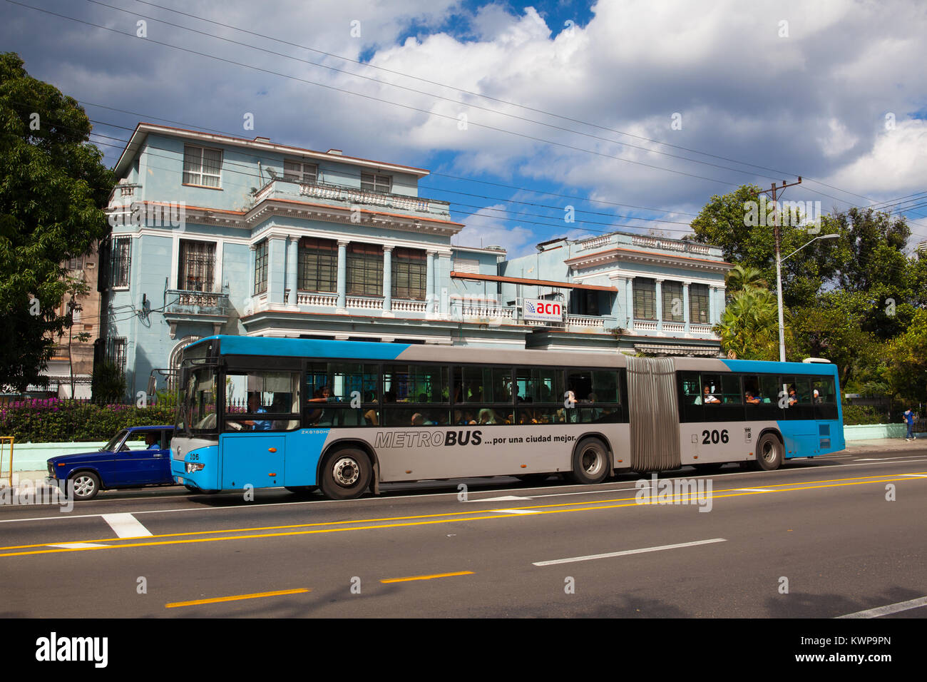 Havana, Cuba - January 21,2017: Typical public bus in front of an old colonial building on the Havana street. Cuba Stock Photo