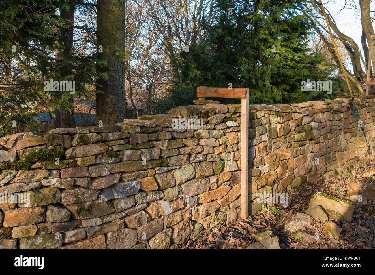 A section of dry stone wall in the process of being rebuilt, a