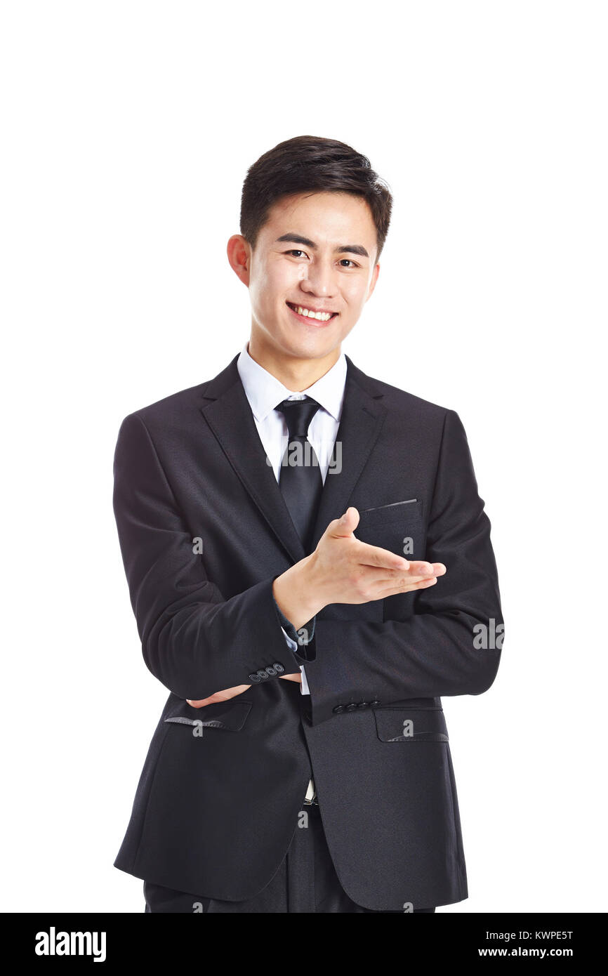 young asian businessman making an invitation, looking at camera smiling, isolated on white background. Stock Photo