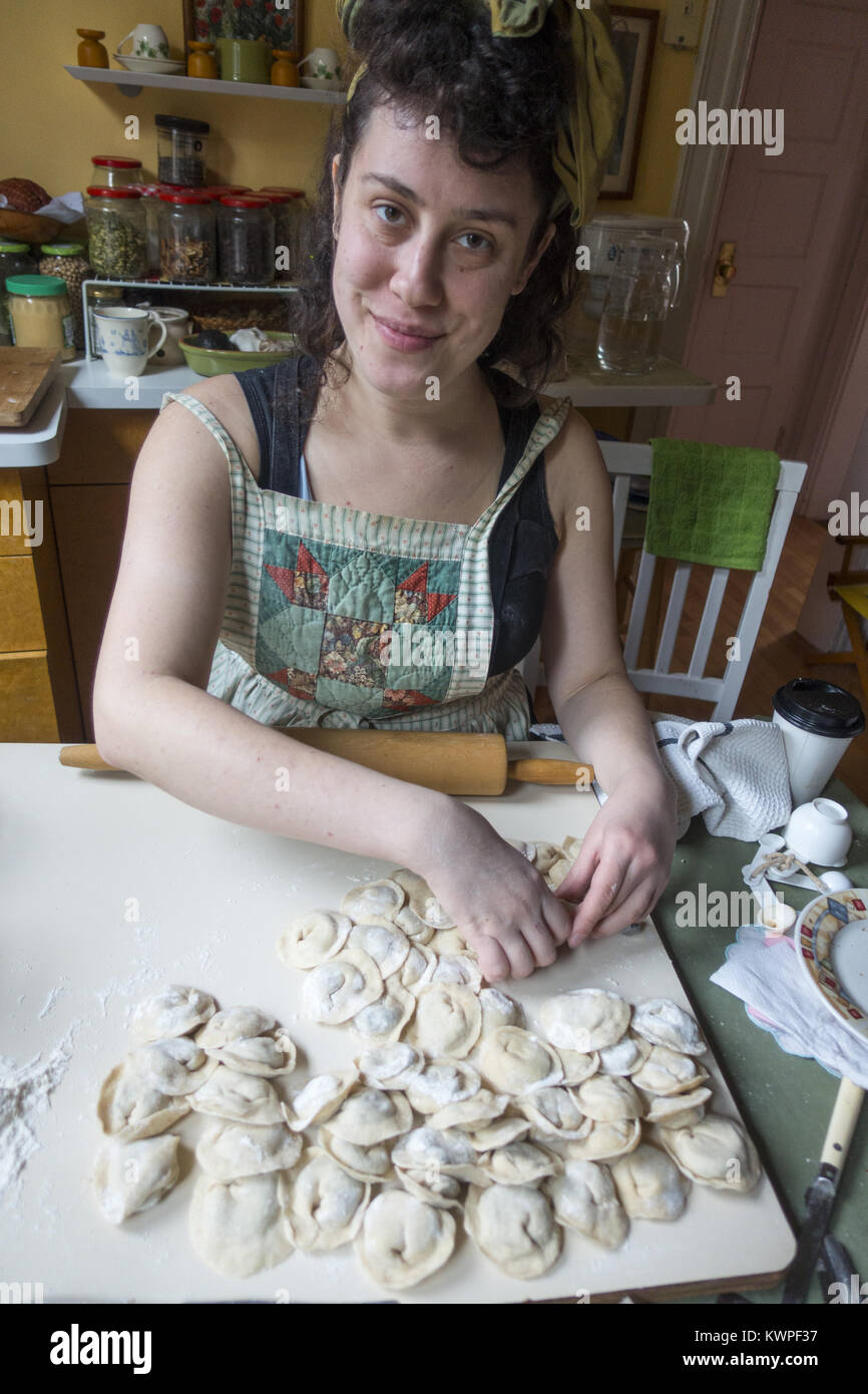 Polish American woman makes pierogi for soup for traditional Christmas Eve dinner. Brooklyn; New York City; NYC; NY; US; USA; America; United states Stock Photo