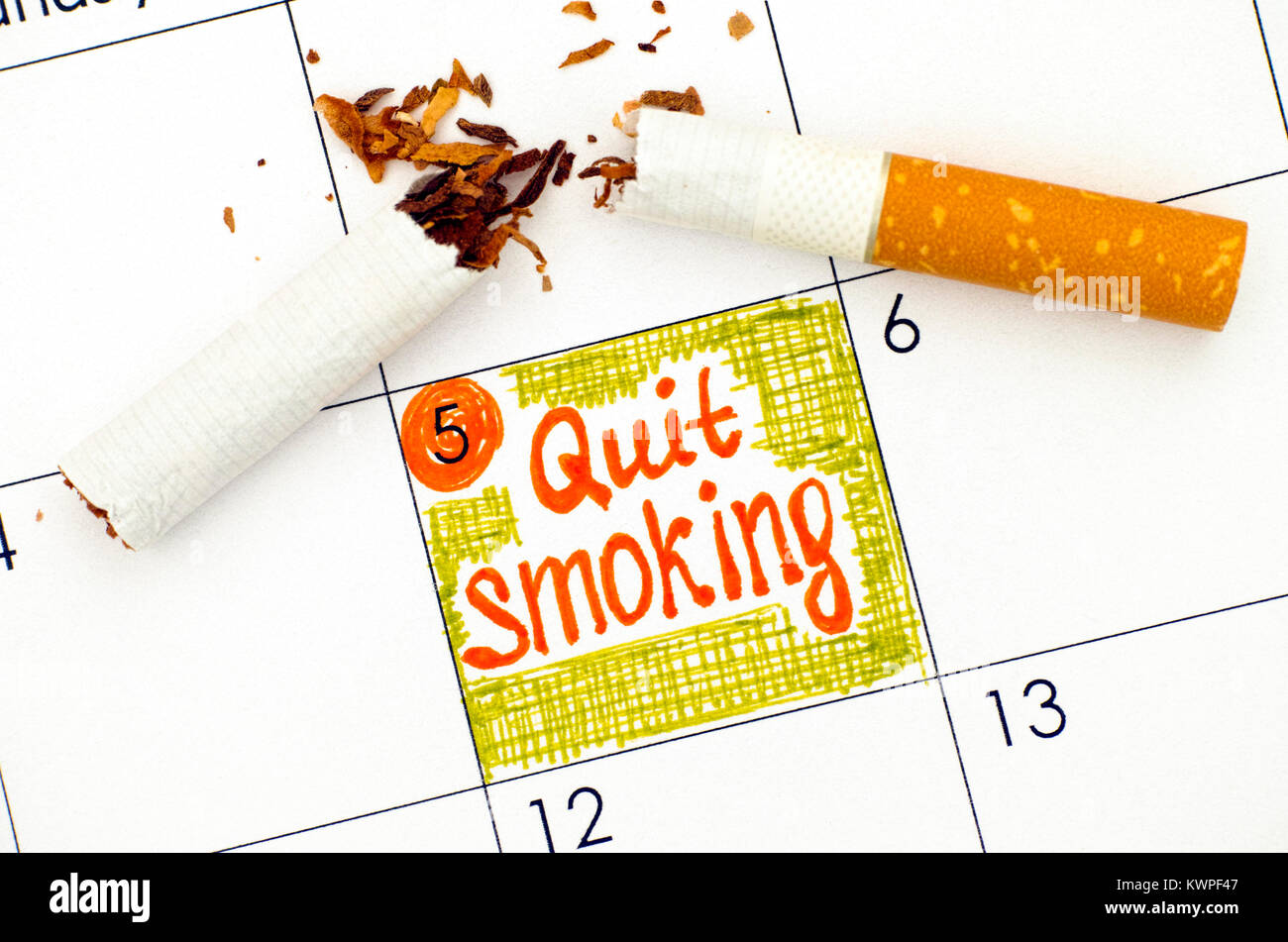 Reminder Quit Smoking in calendar with broken cigarette. Close-up Stock  Photo