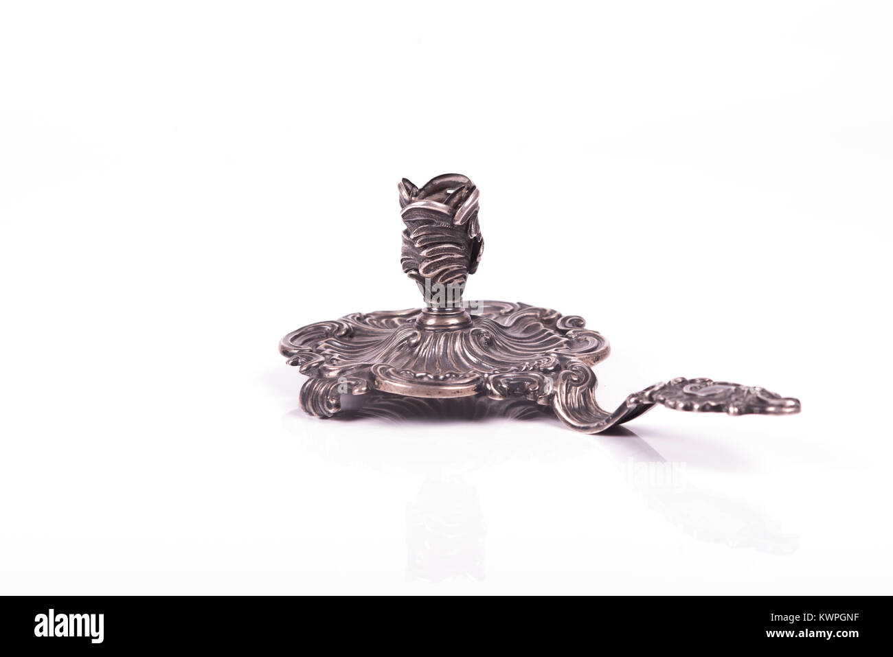 handcrafted silver candlestick over a wite background Stock Photo