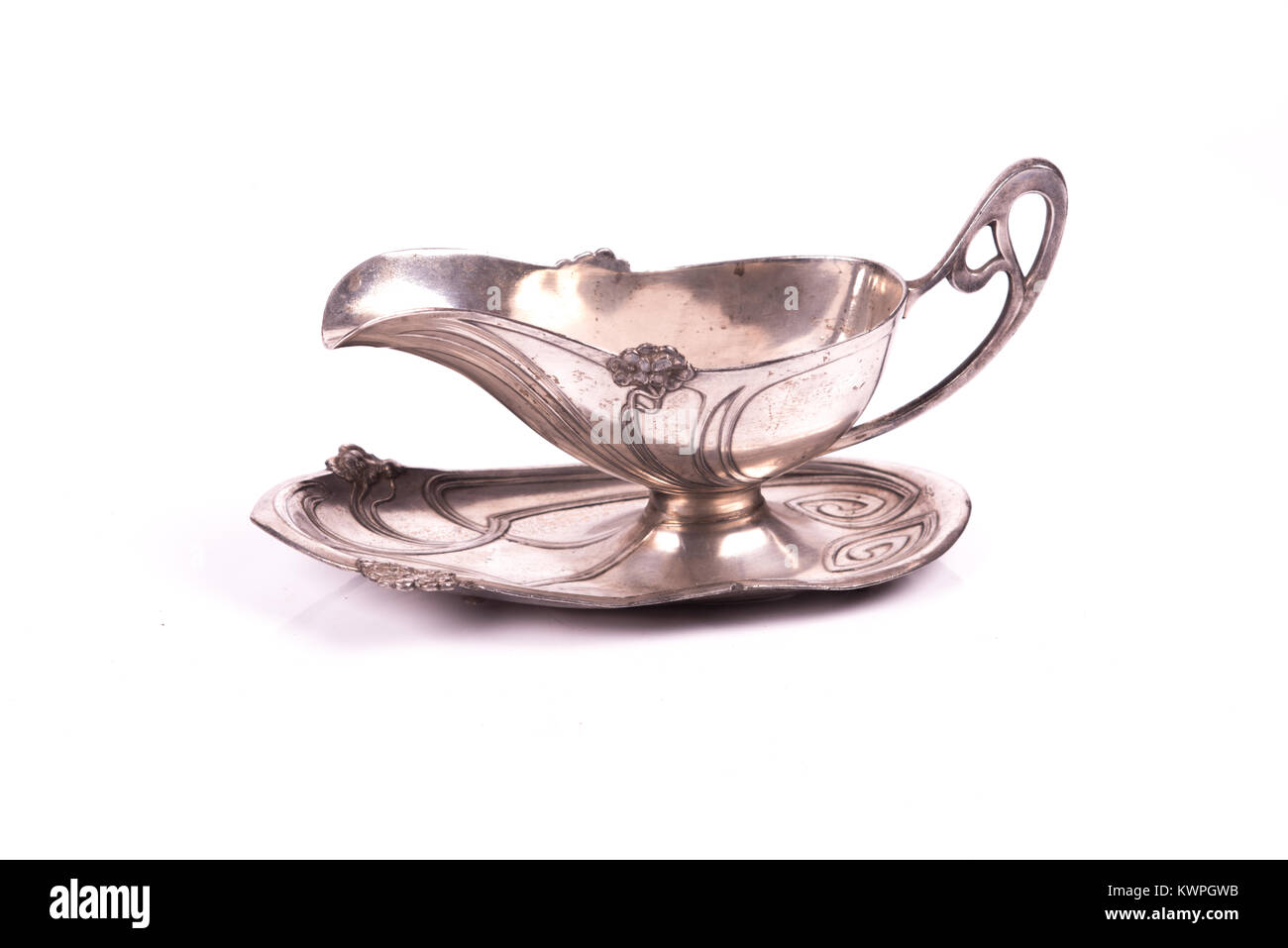 handcrafted art nouveau silver cup sauce over a white background Stock Photo
