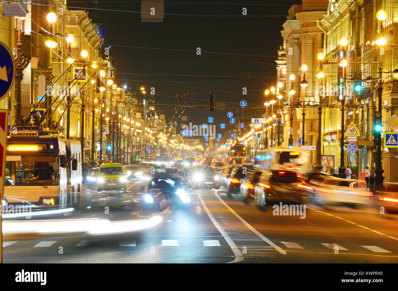 Electric city lights at night.Riding cars create light lines Stock