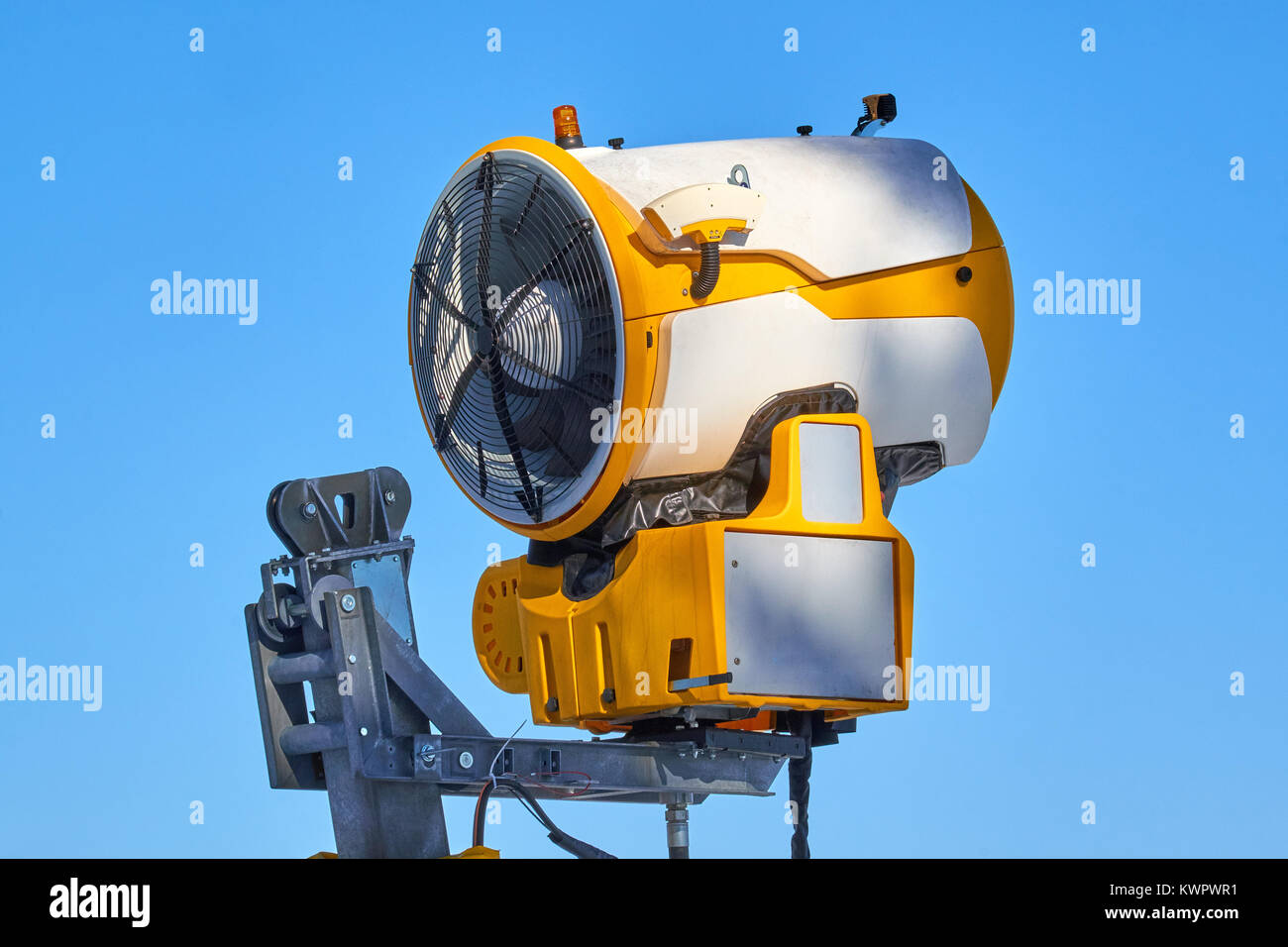 Turned off snow cannon up in the air on a stand at Ski Carousel Winterberg in bright sun Stock Photo