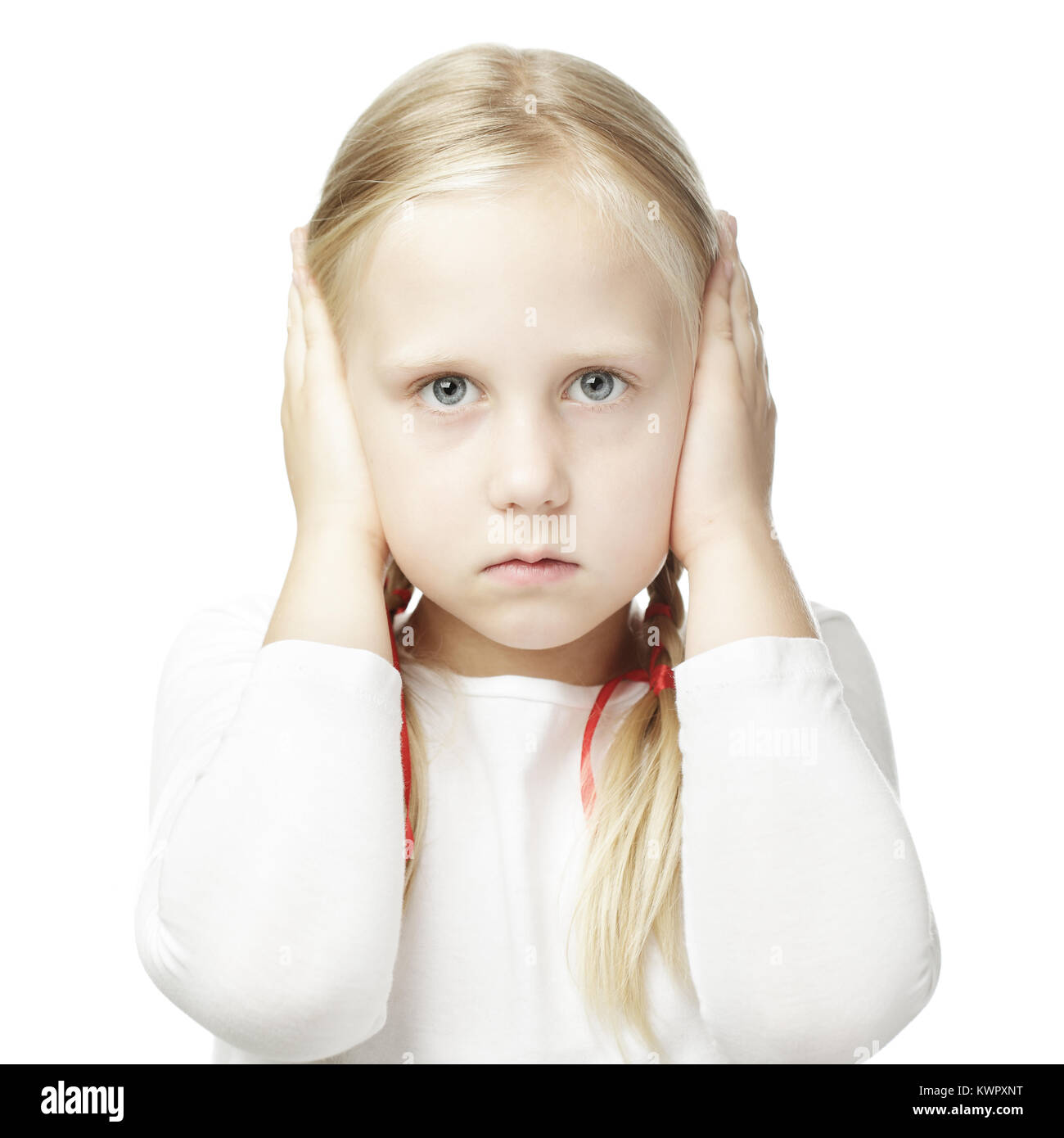 Child closed his hands over his ears and hears nothing Stock Photo
