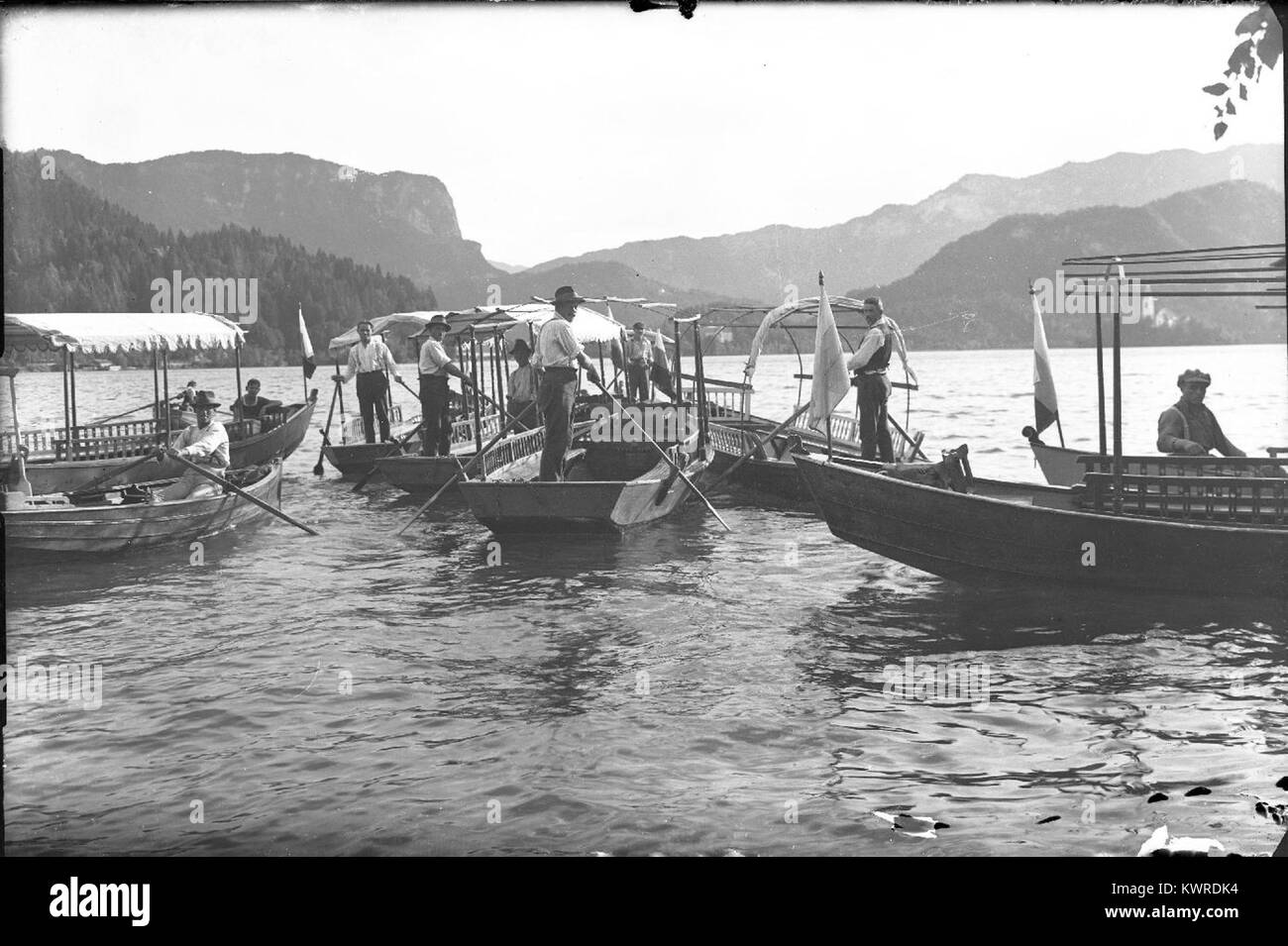 Boatmen rowing boats on Black and White Stock Photos & Images - Alamy